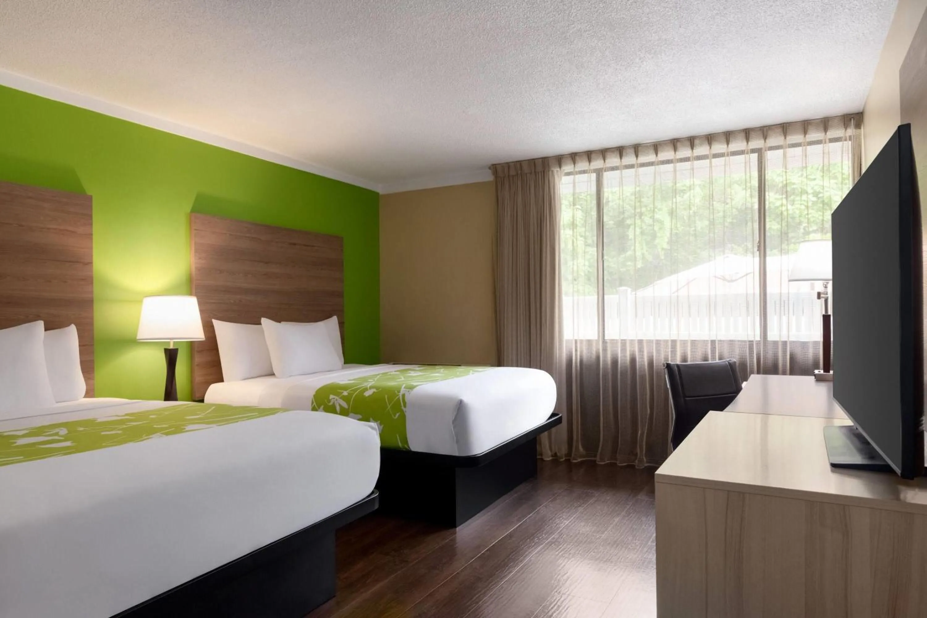 Photo of the whole room, Bed in Wyndham Garden Washington DC North