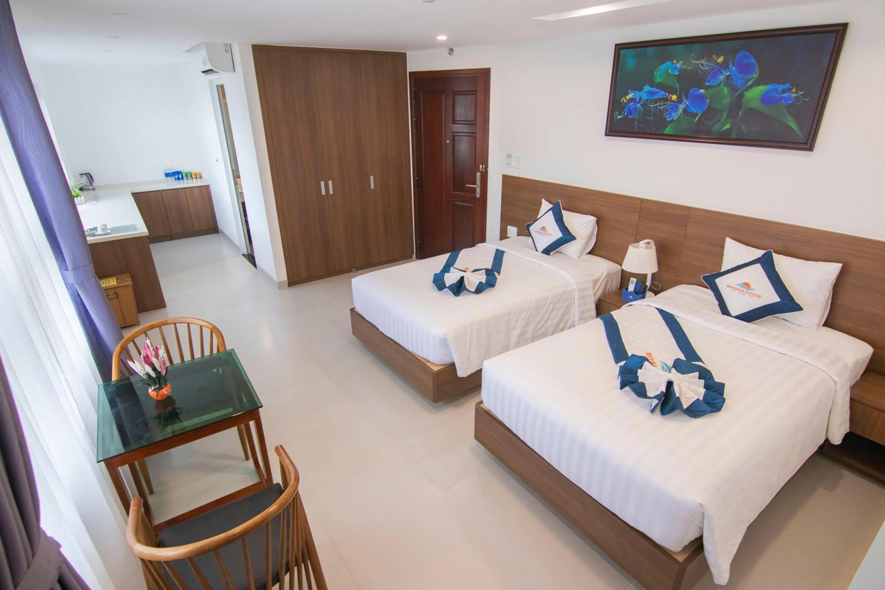 Photo of the whole room, Bed in Mermaid Seaside Hotel