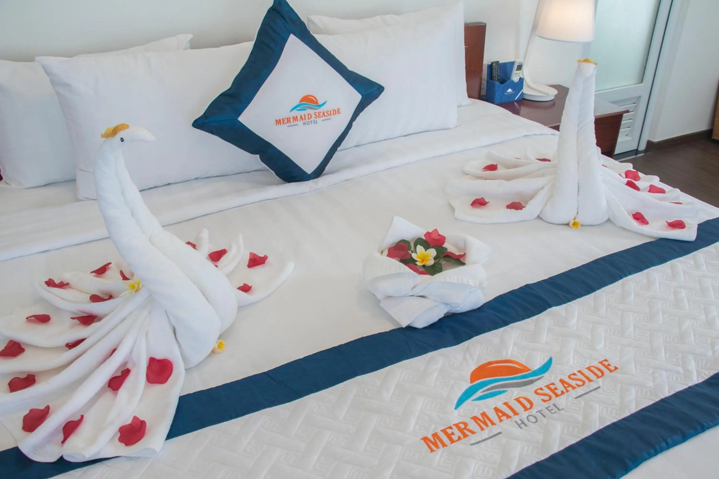 Bed in Mermaid Seaside Hotel