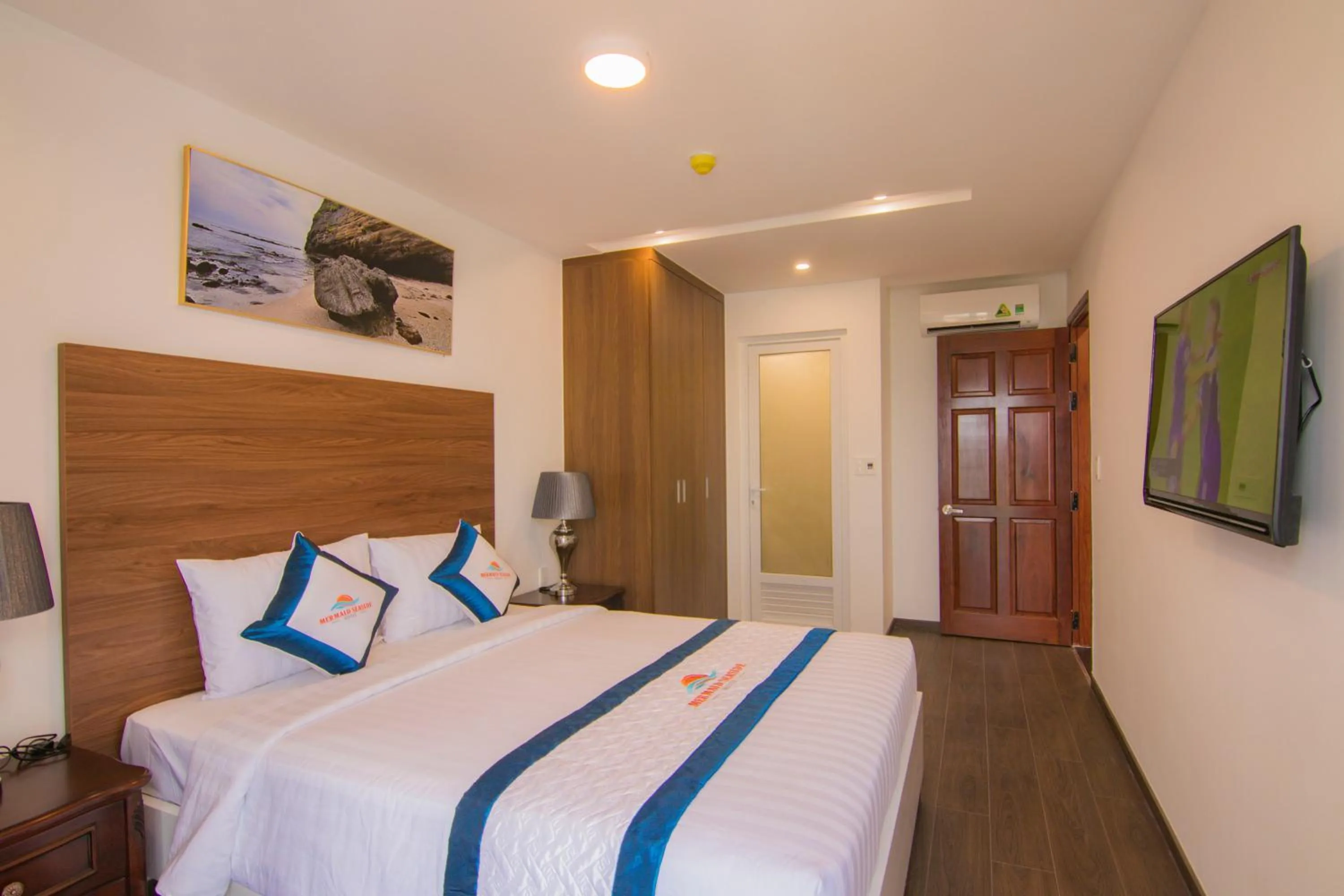 Bed in Mermaid Seaside Hotel