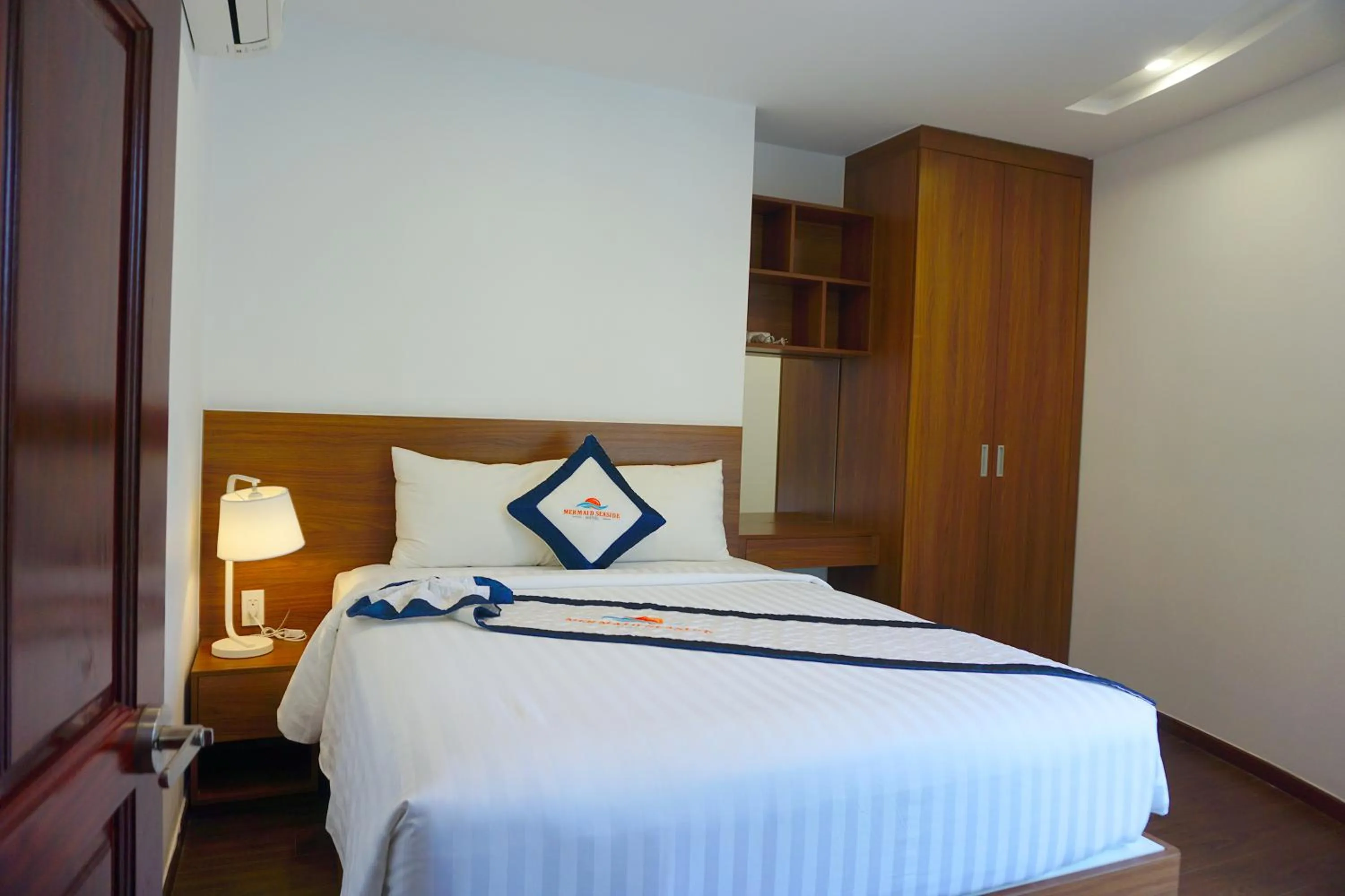 Bed in Mermaid Seaside Hotel