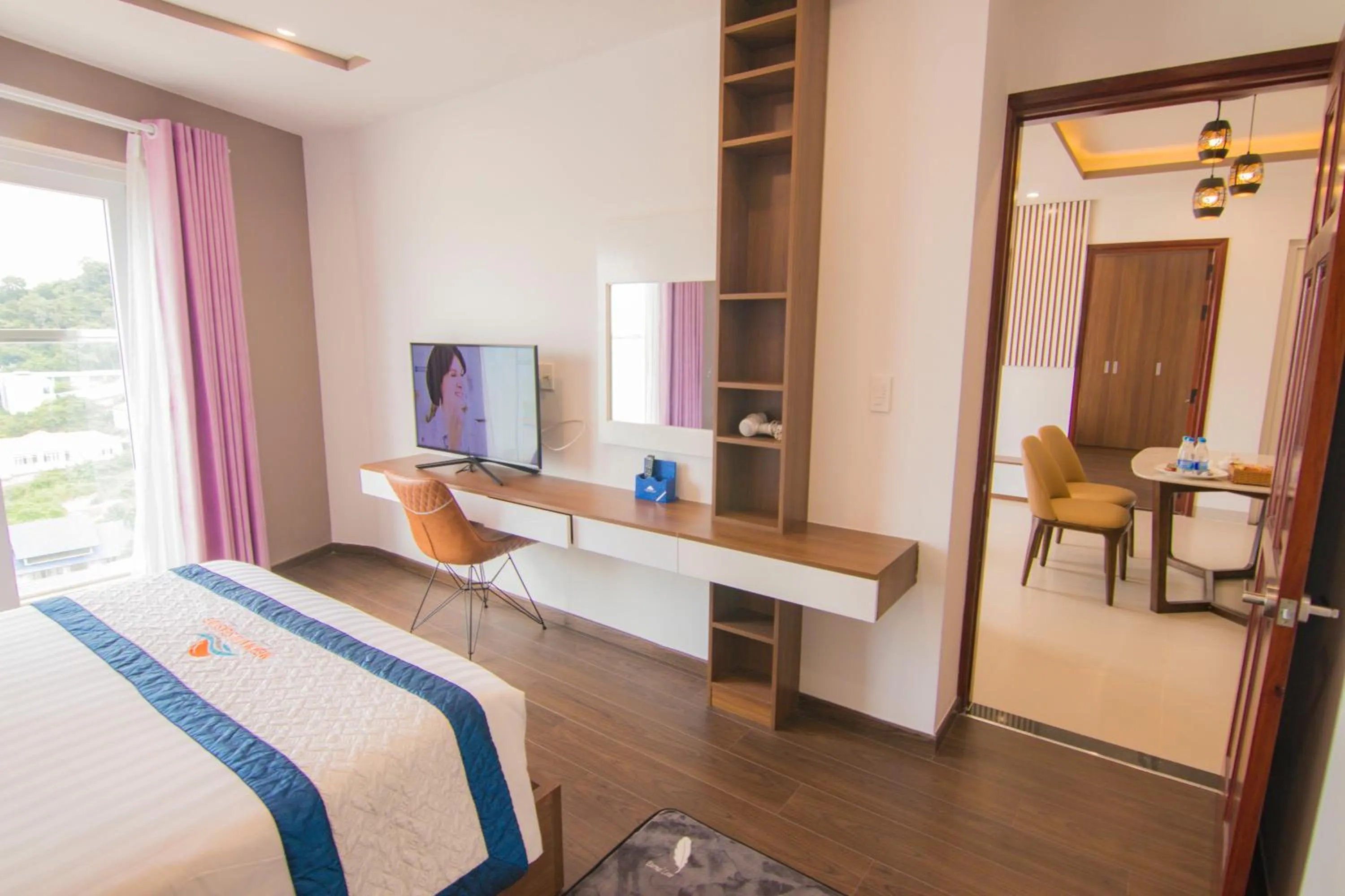 Communal lounge/ TV room, Bed in Mermaid Seaside Hotel