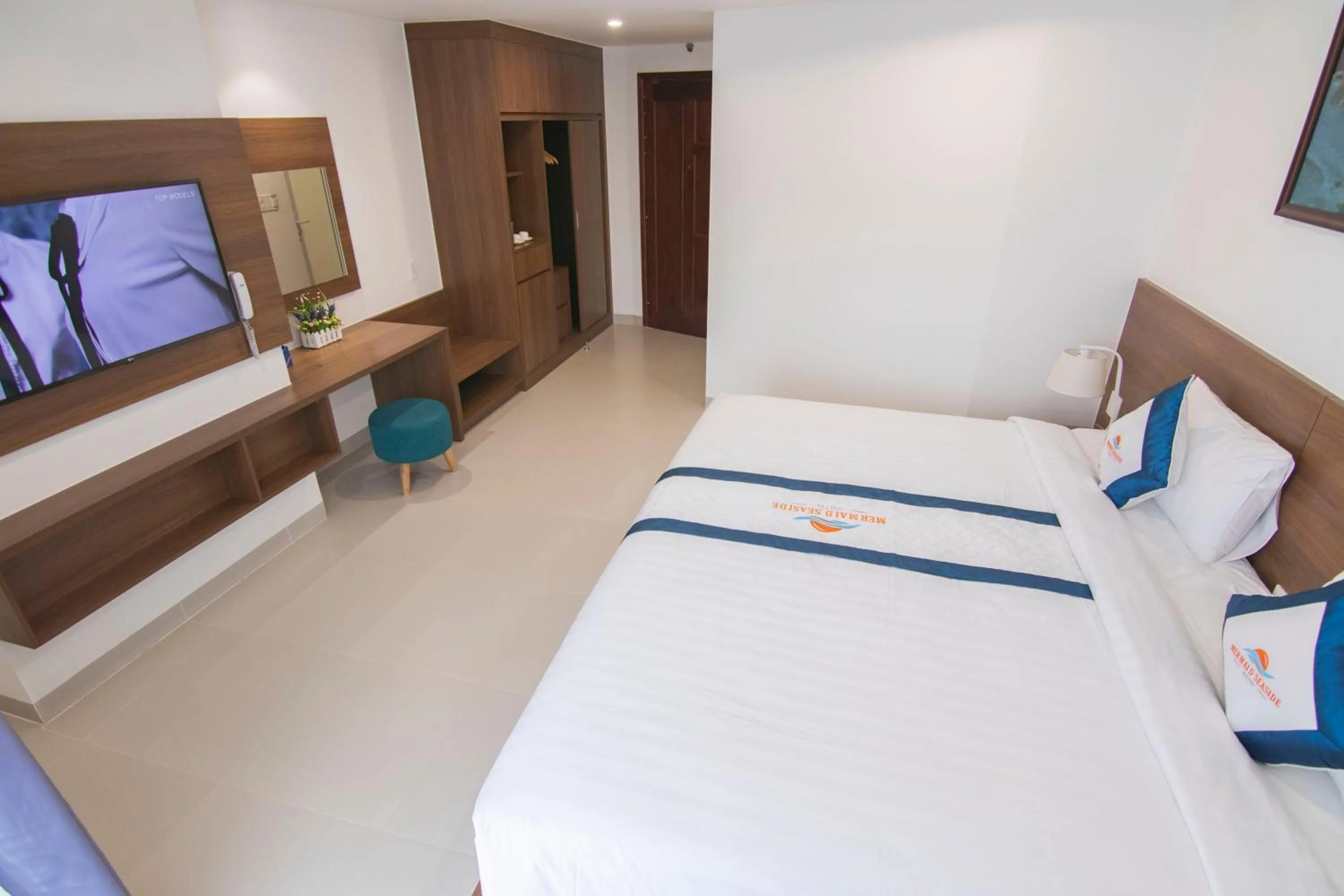 Bed in Mermaid Seaside Hotel