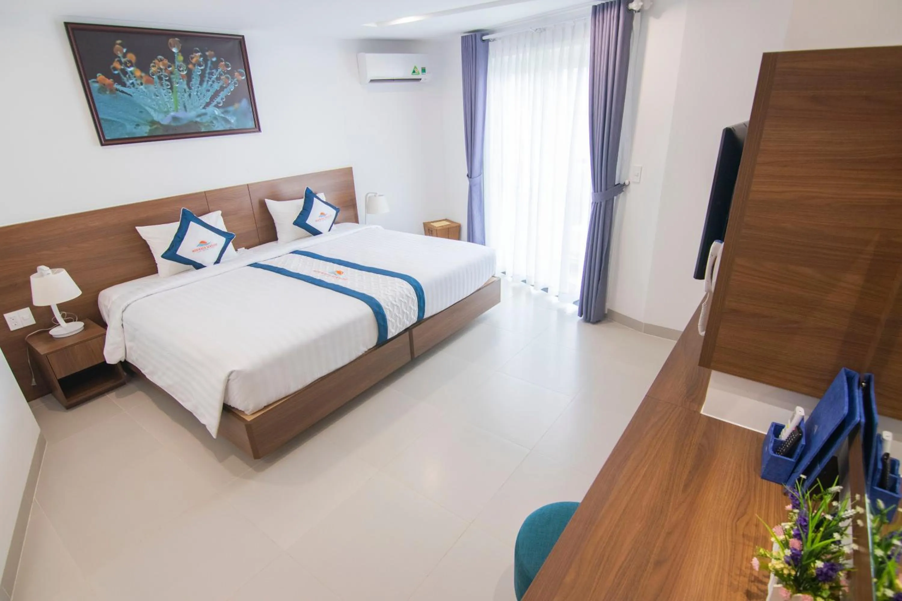 Bed in Mermaid Seaside Hotel