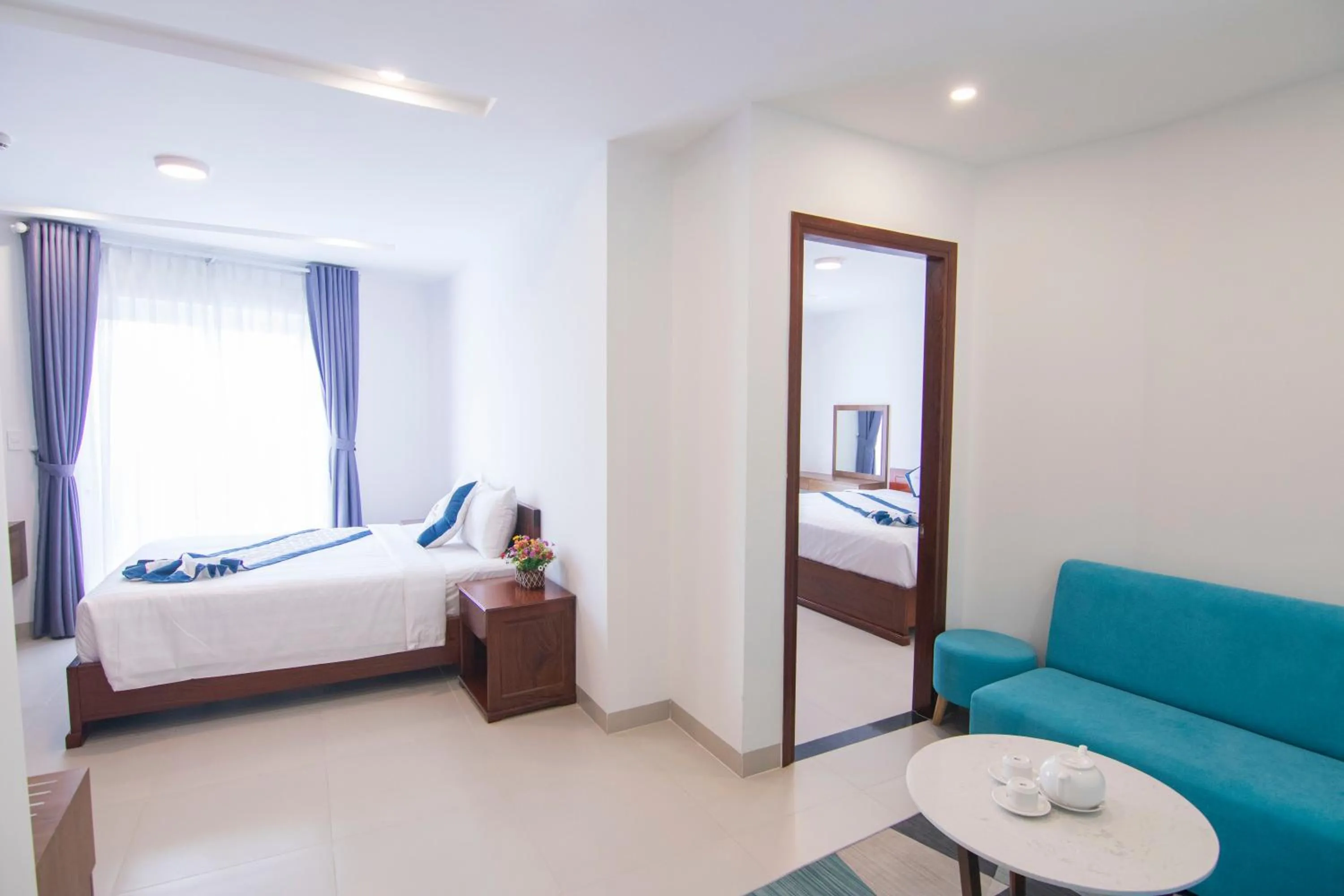 Bed in Mermaid Seaside Hotel