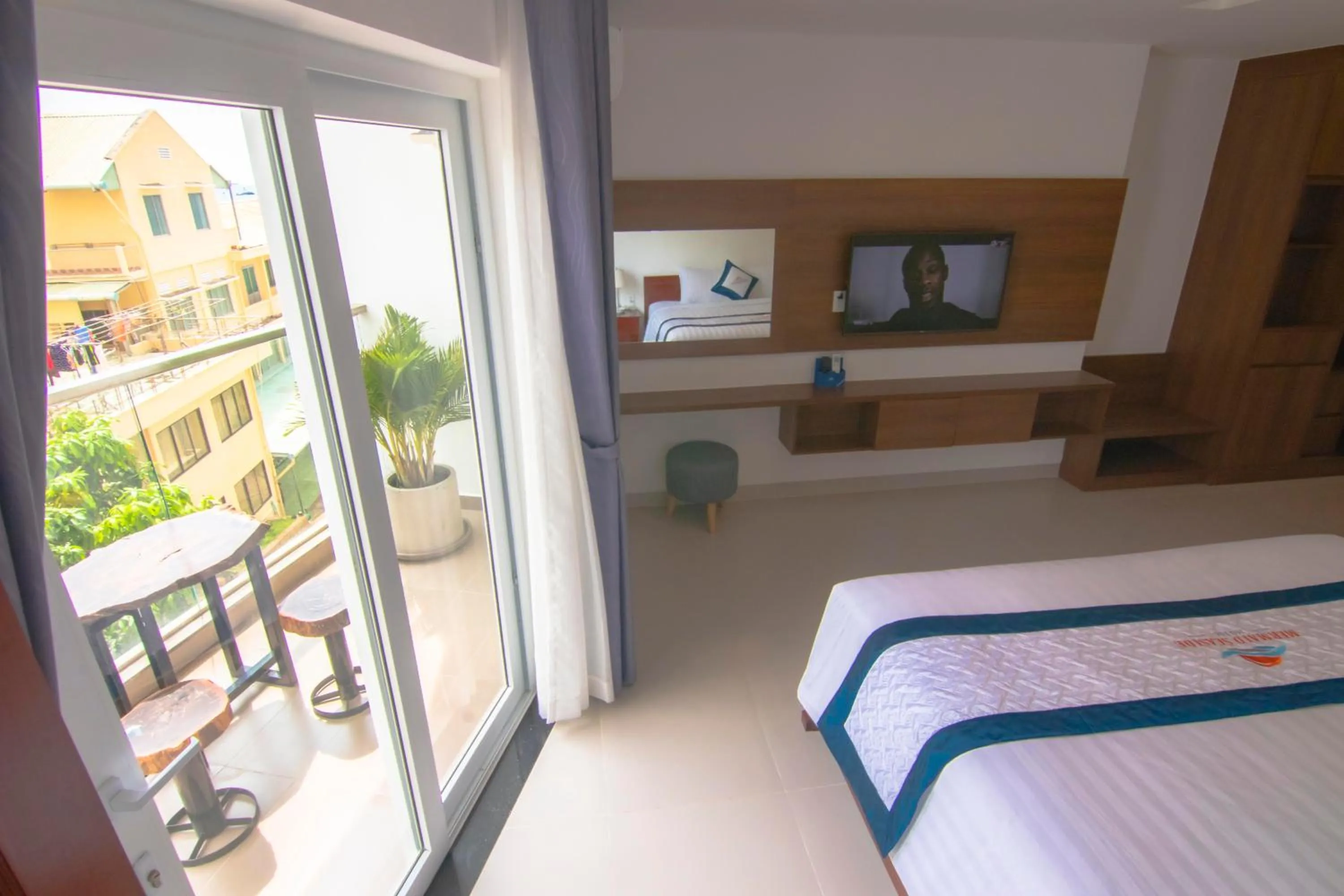 Balcony/Terrace, Bed in Mermaid Seaside Hotel