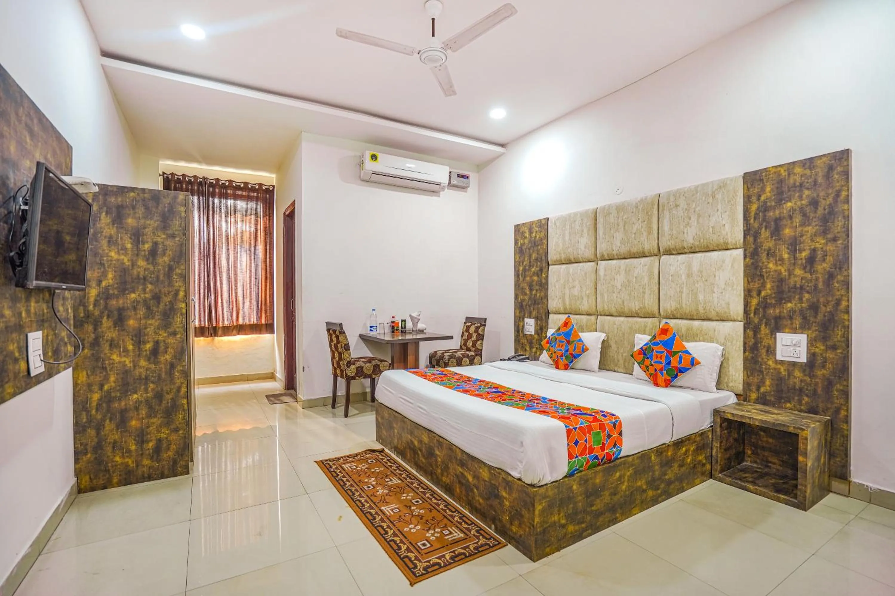 Bed in FabHotel Grand Inn