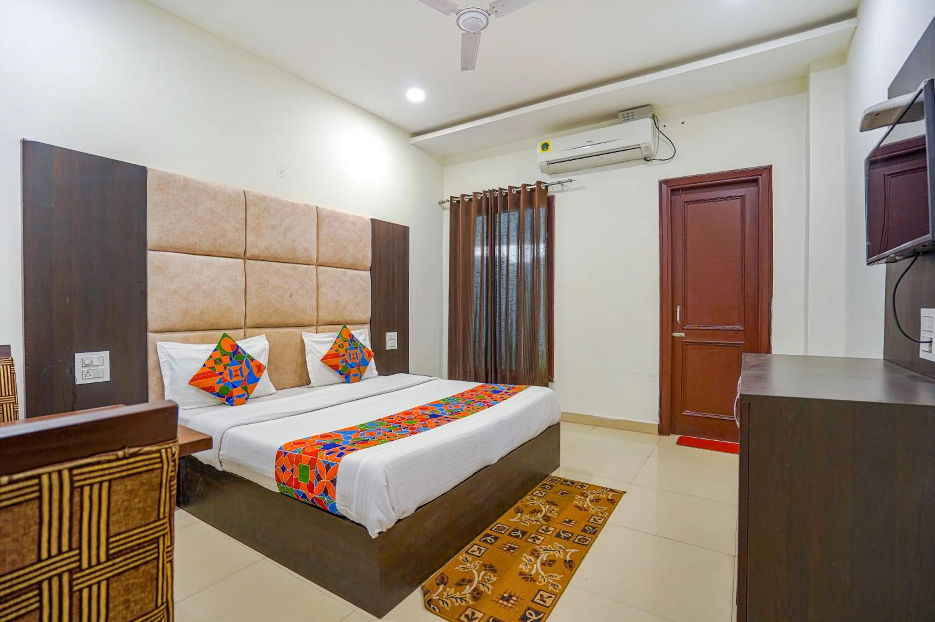 Bed in FabHotel Grand Inn