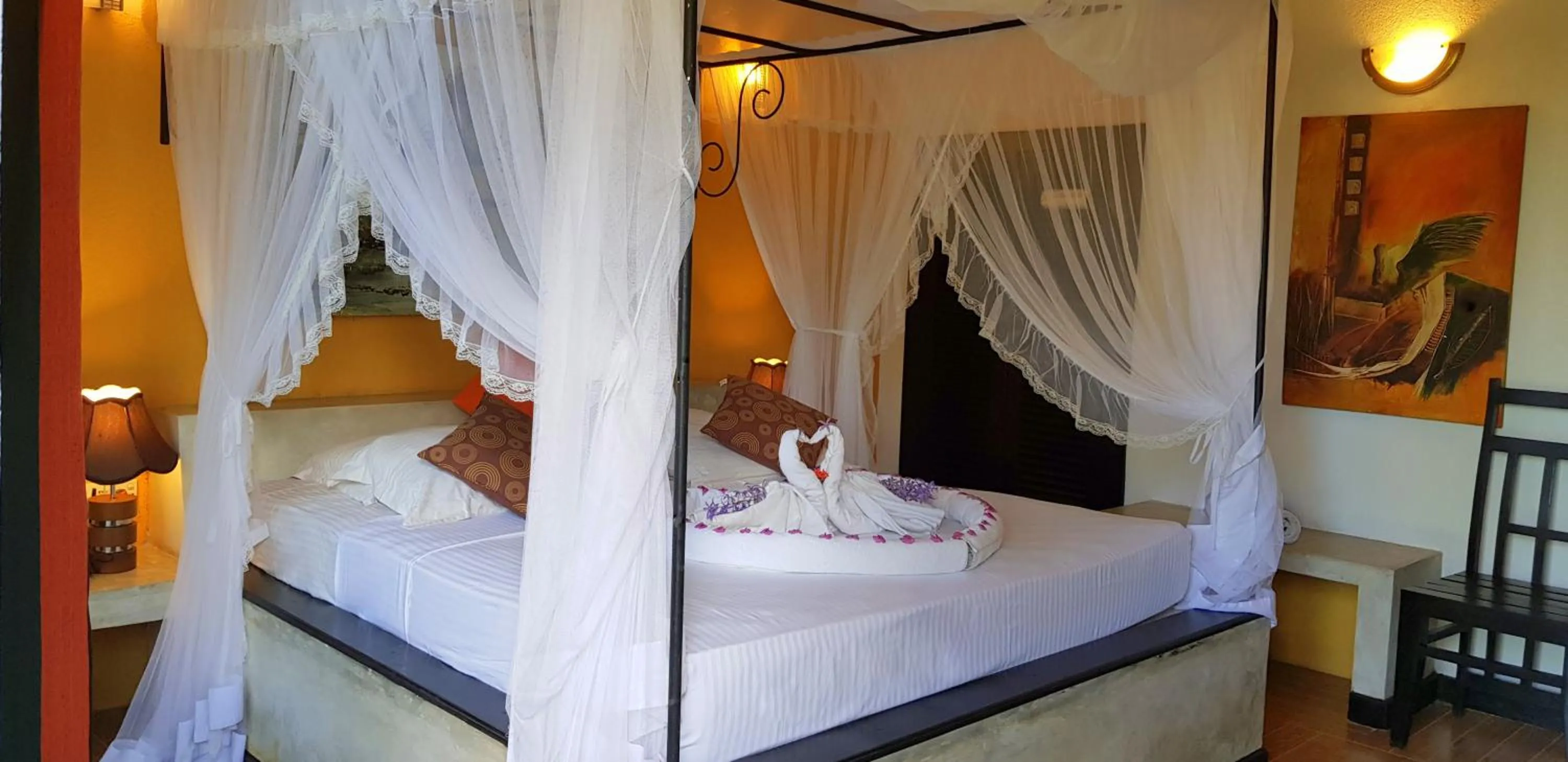 Bed in Flower Garden Lake Resort