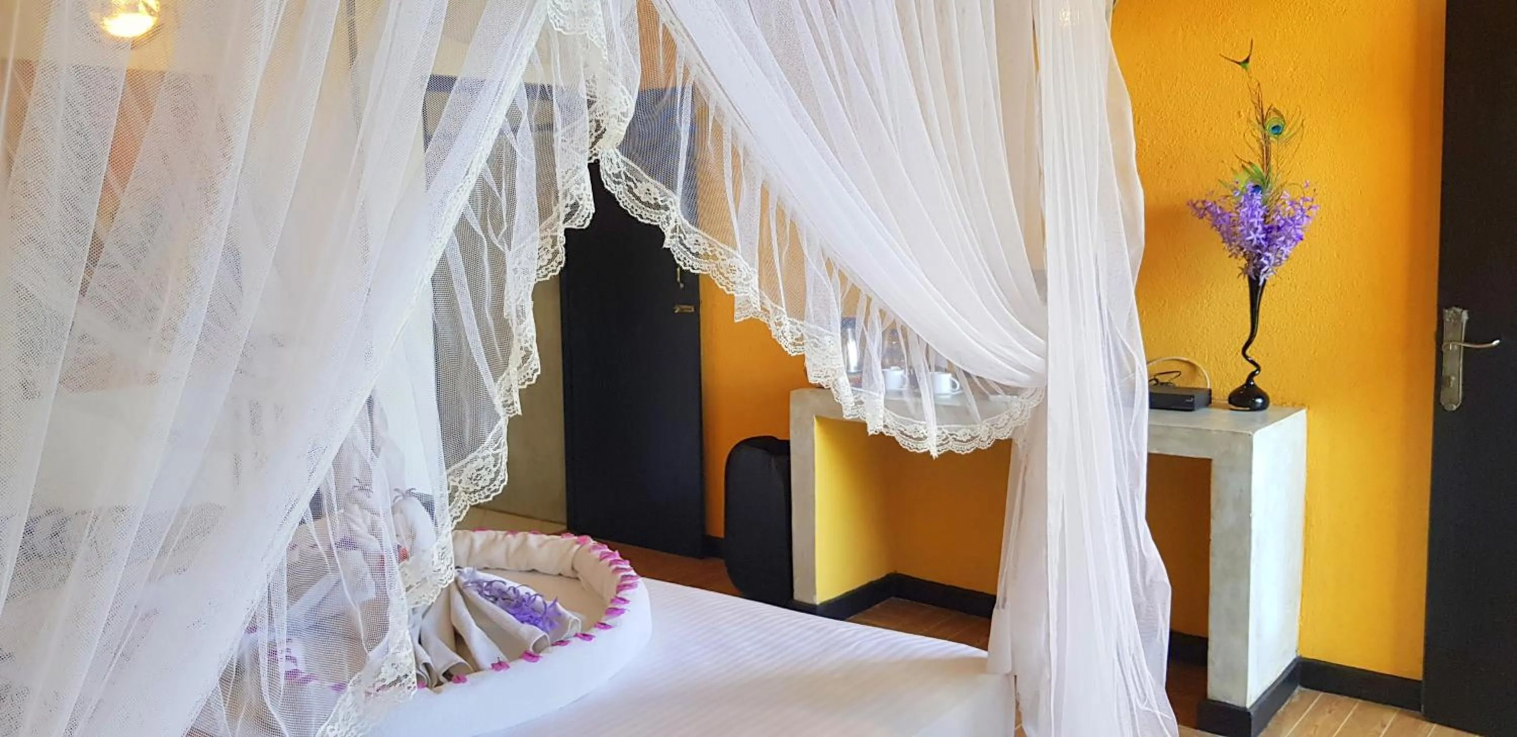 Bed in Flower Garden Lake Resort