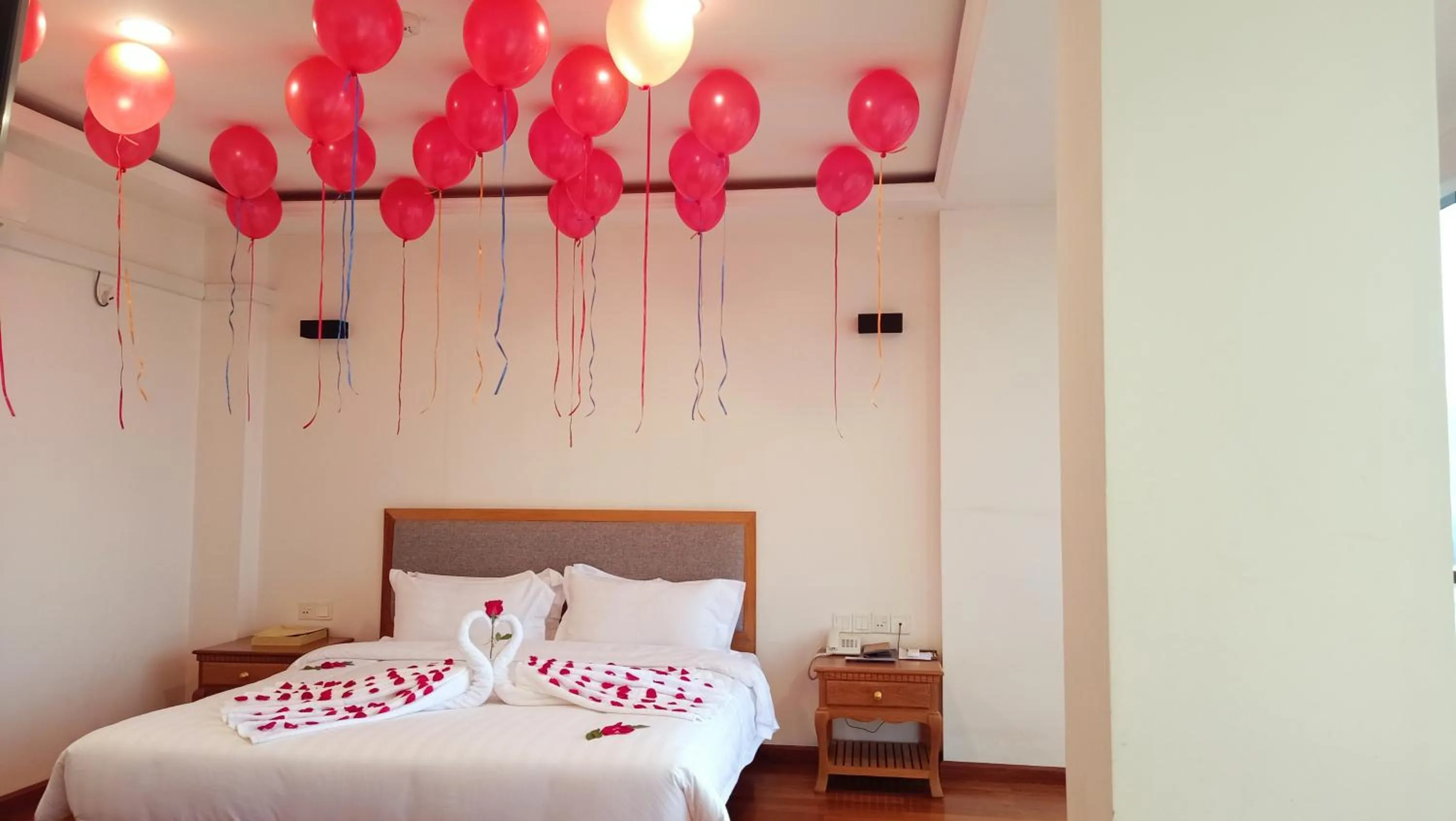 Bed in Dragon Phoenix Hotel