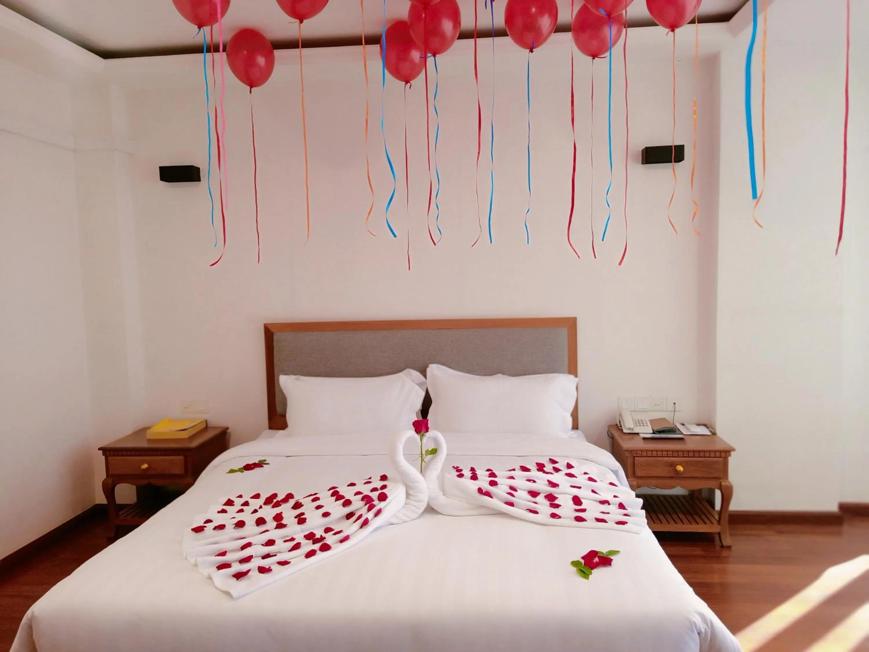 Bed in Dragon Phoenix Hotel