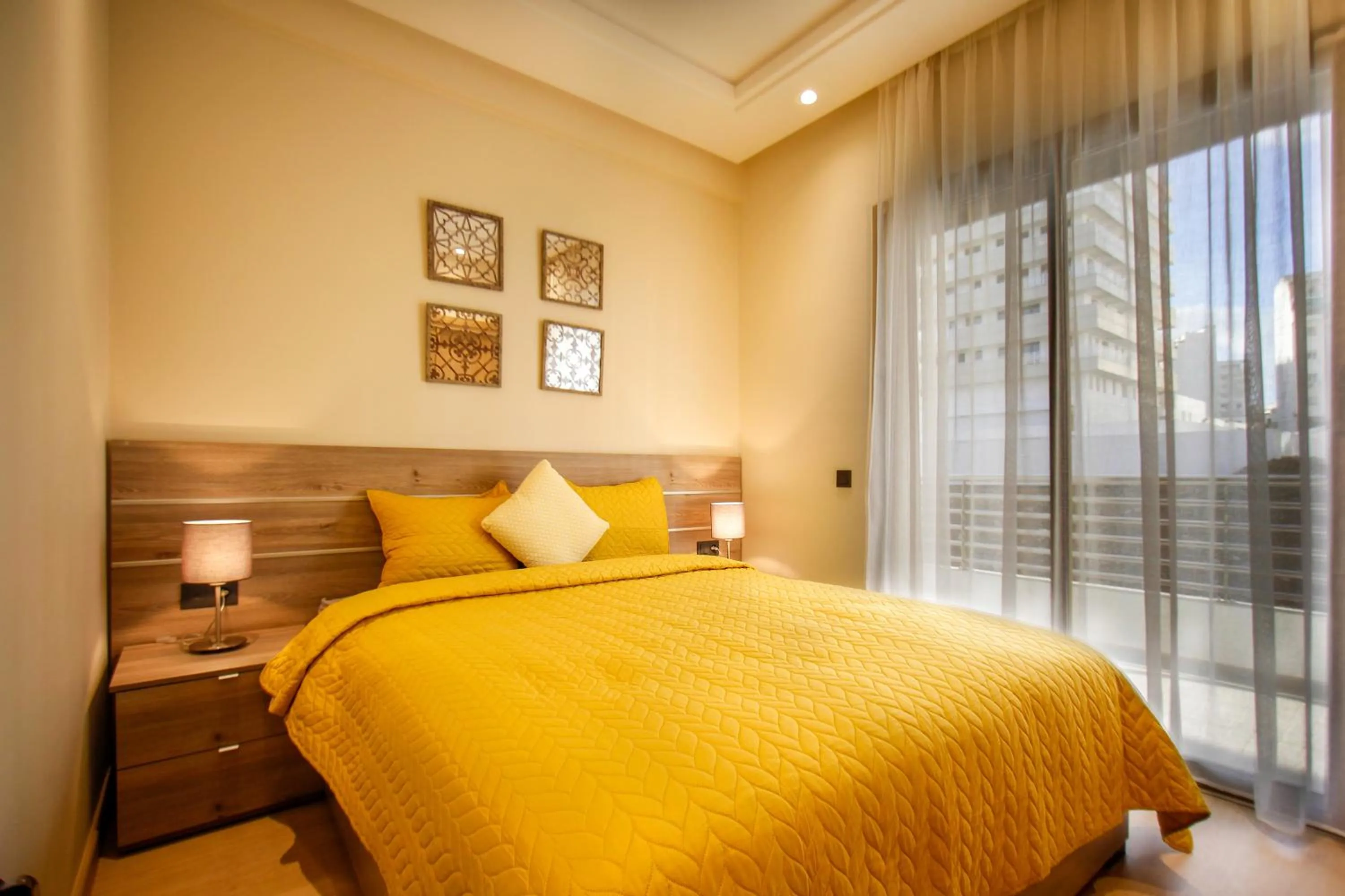 Bed in Flamant Rose Appart Hotel