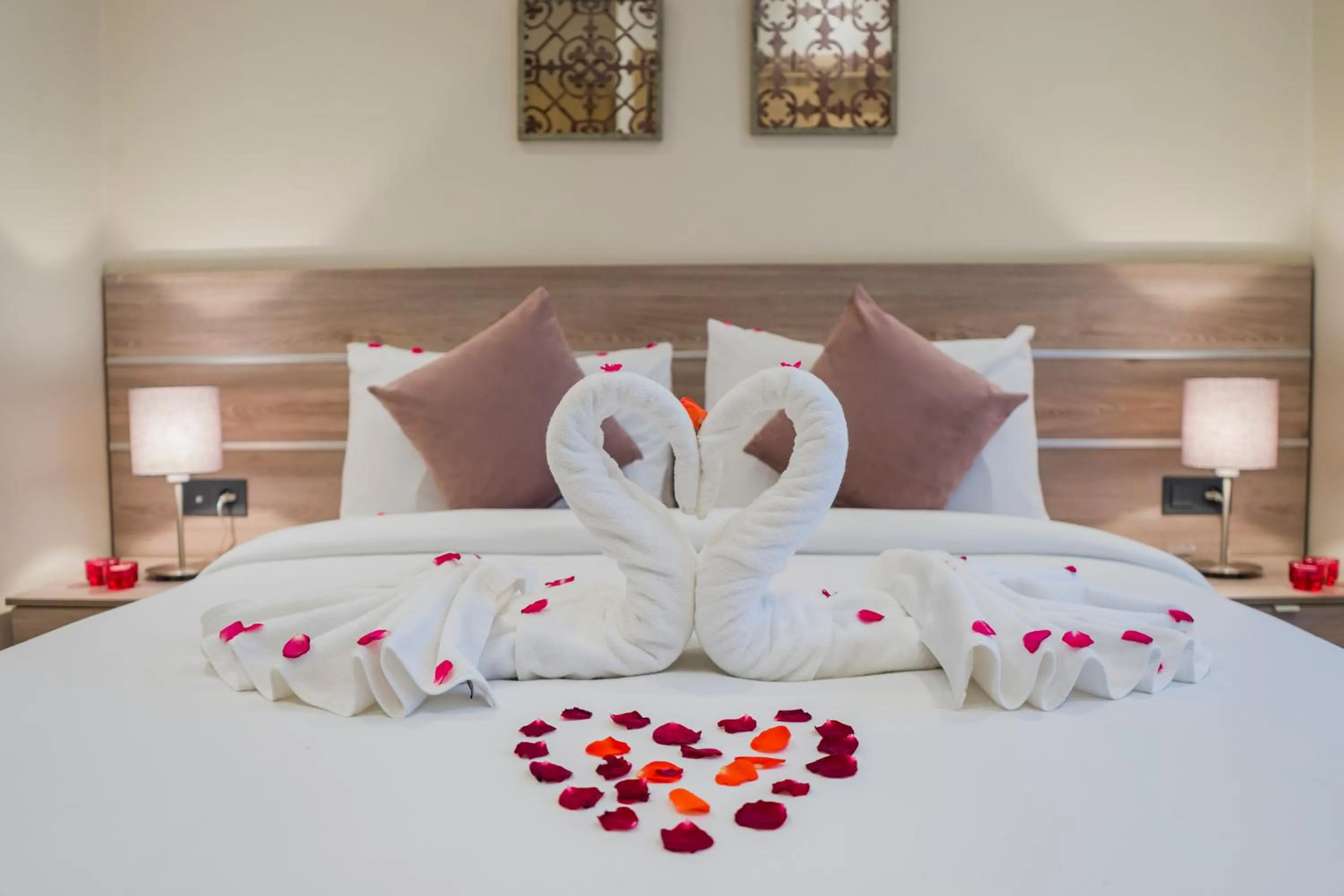 Bed in Flamant Rose Appart Hotel