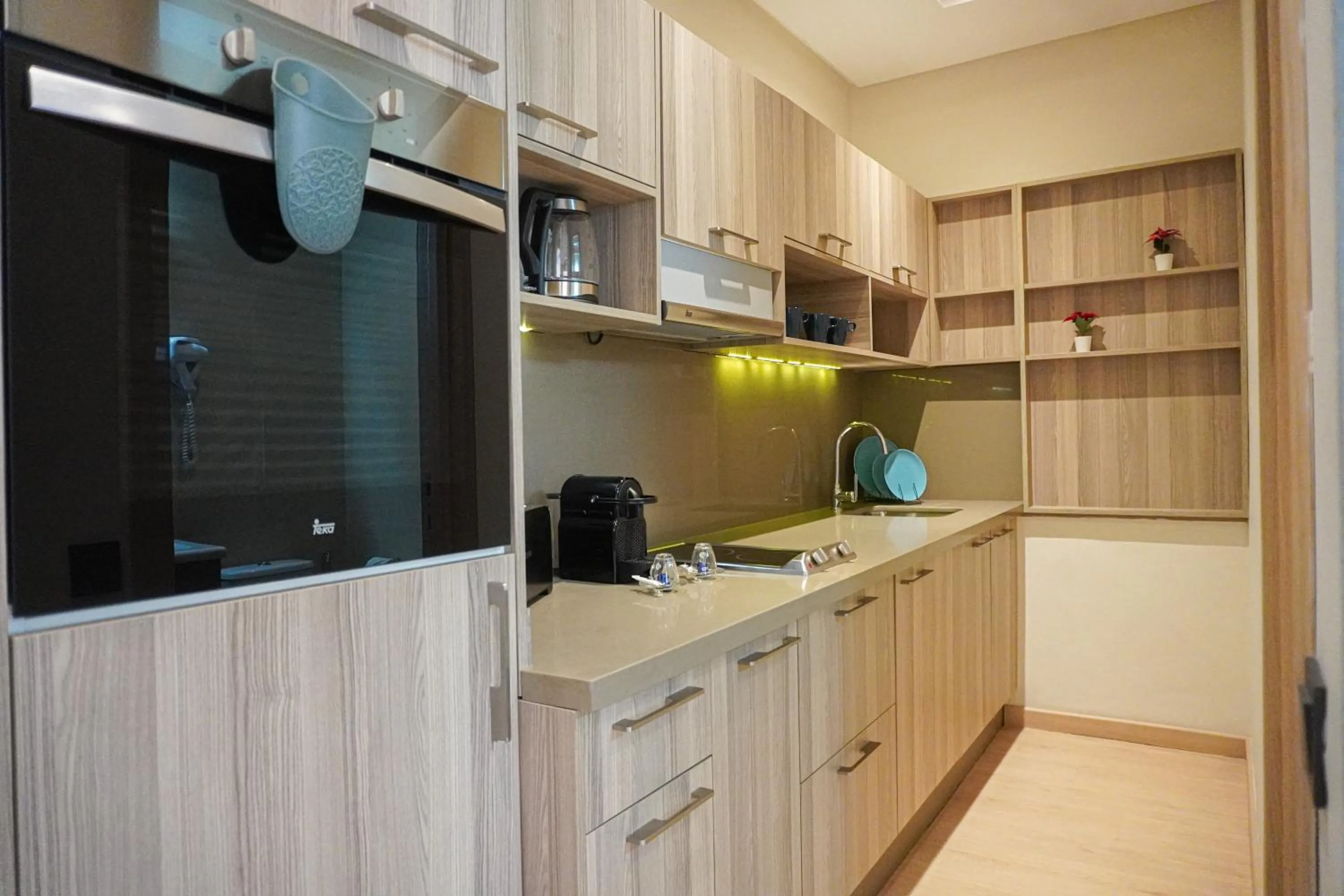 kitchen in Flamant Rose Appart Hotel