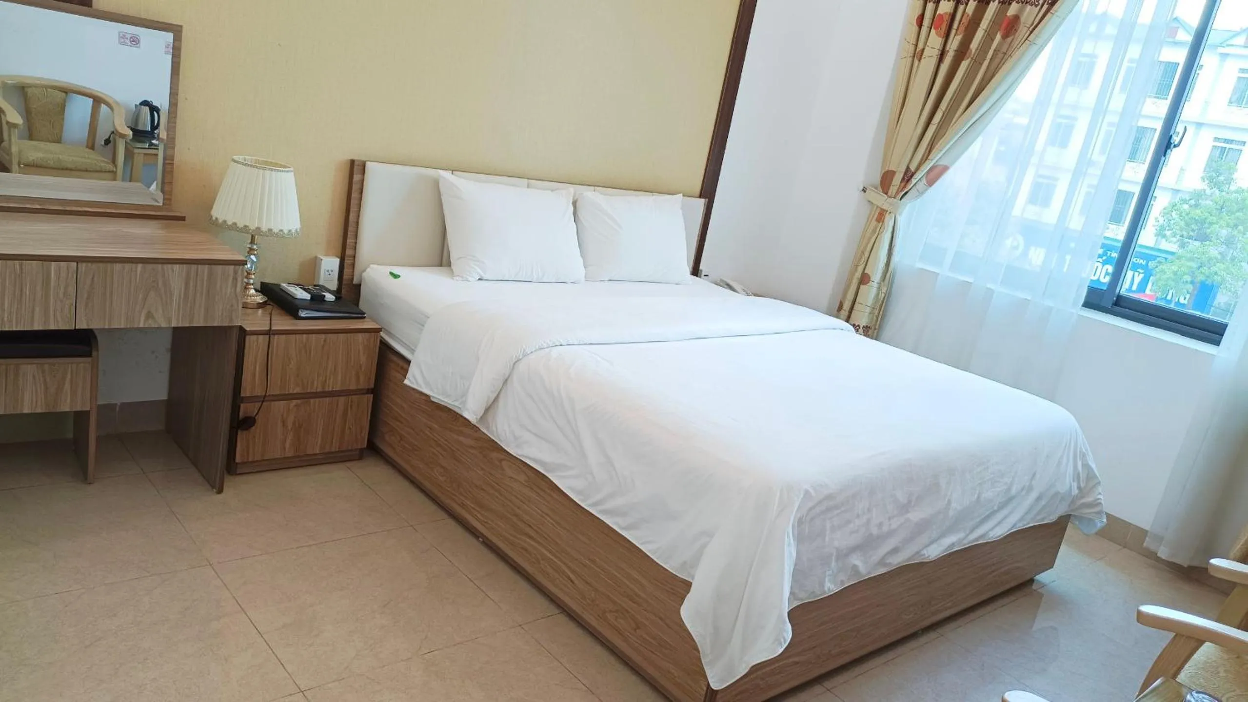 Bed in Galaxy Grand Hotel