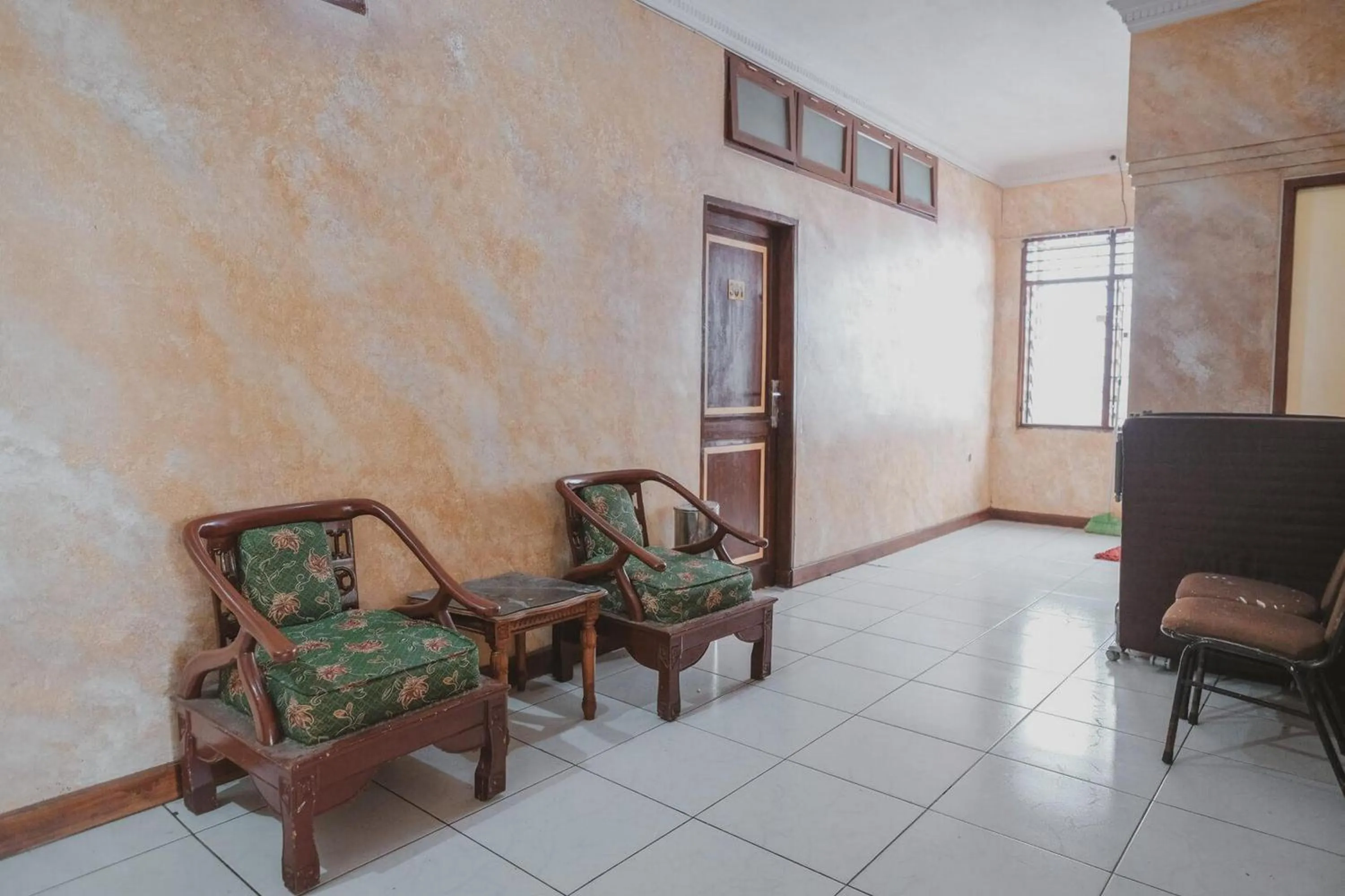 Seating area in RedDoorz Plus near Istana Maimun Medan