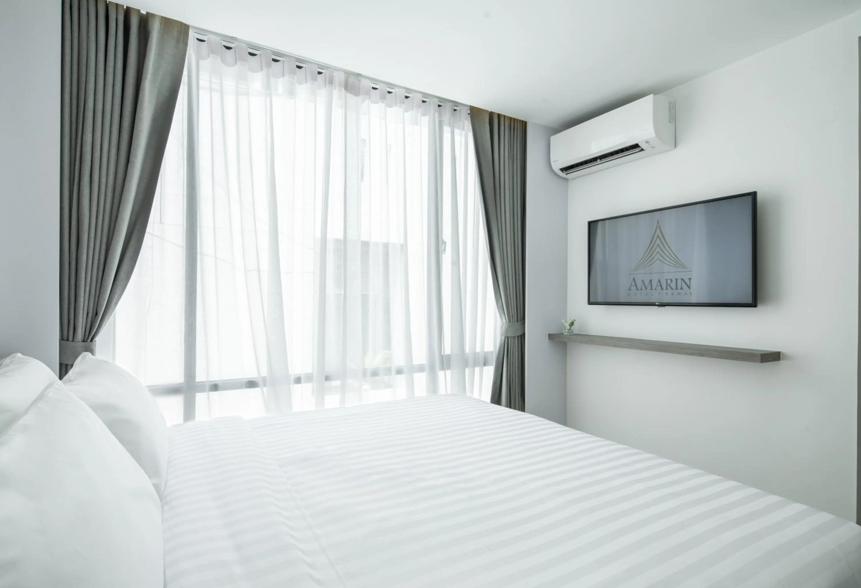Bed in Amarin Hotel Rama 8
