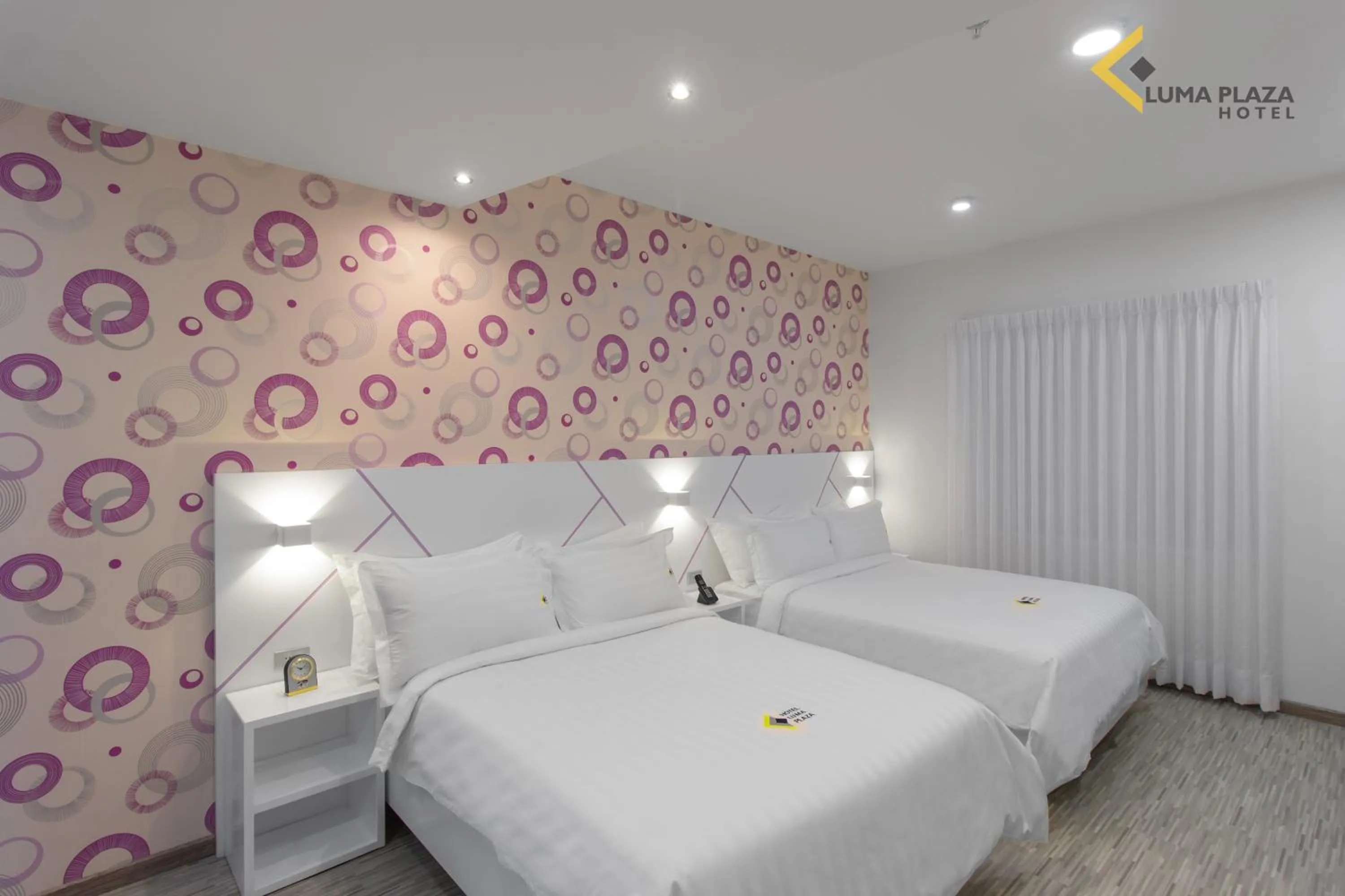 Bed in Luma Plaza Hotel