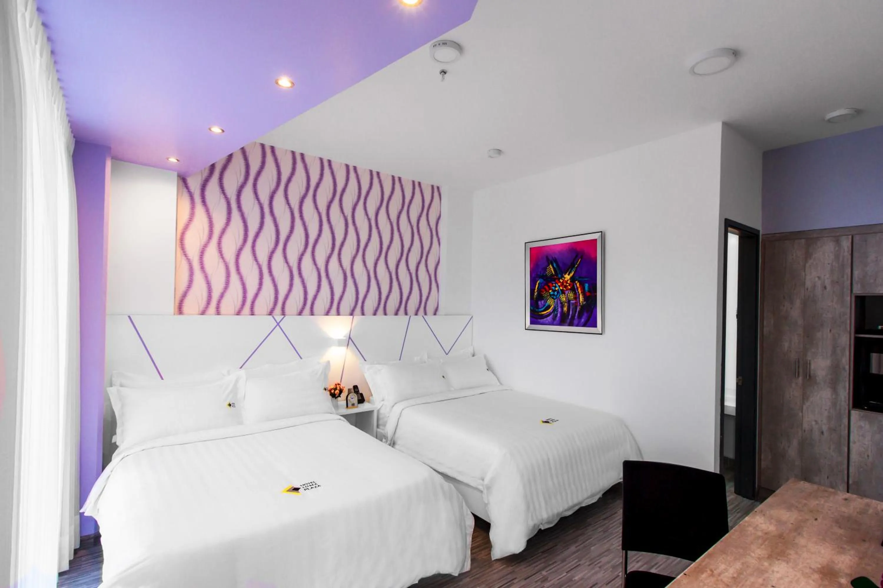 Bed in Luma Plaza Hotel