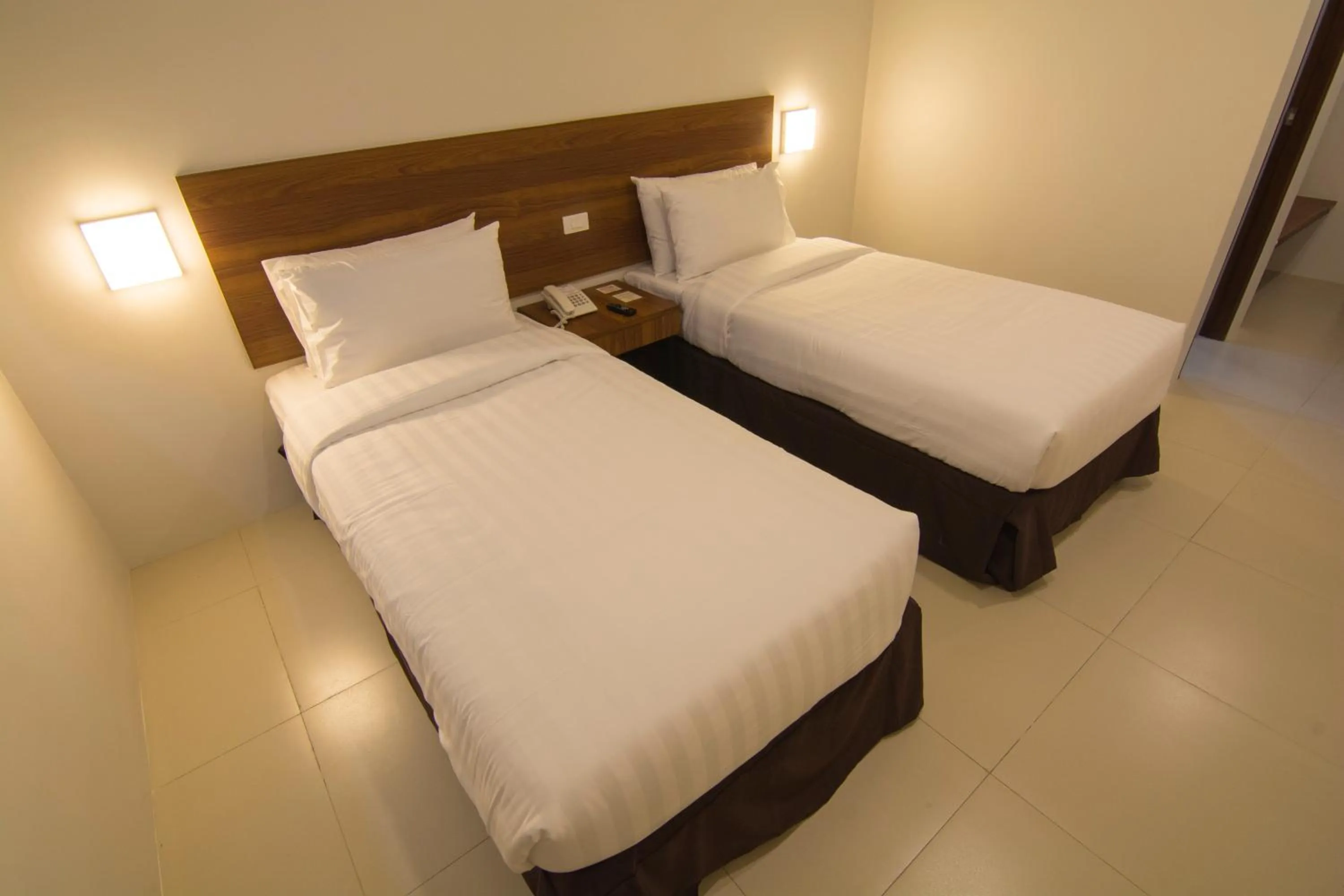 Bed in Mango Suites Cauayan