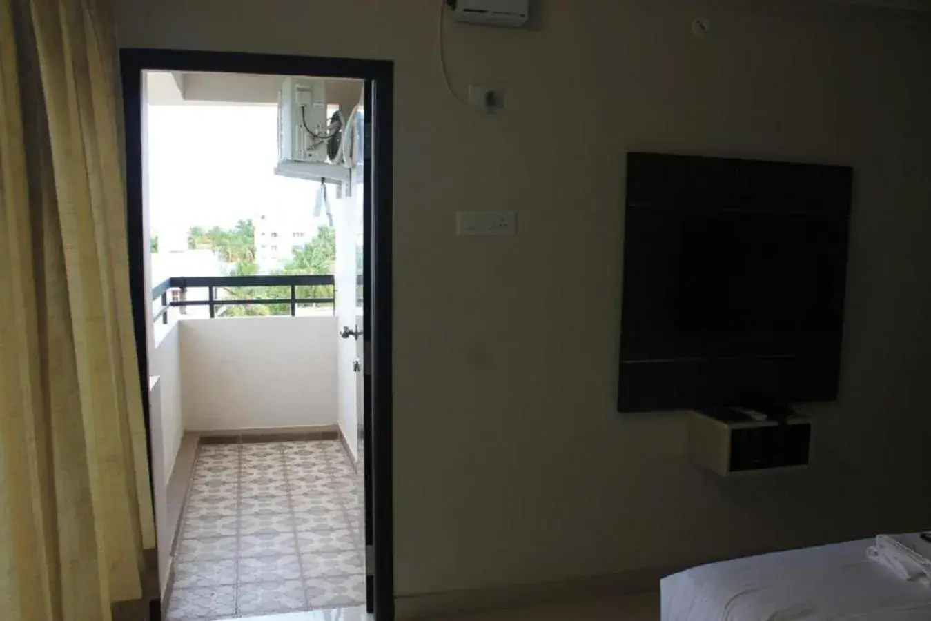 Deluxe Double Room with Balcony - single occupancy in Viswa Residency by Azalea Deluxe Double Room with Balcony - single occupancy in Viswa Residency by Azalea