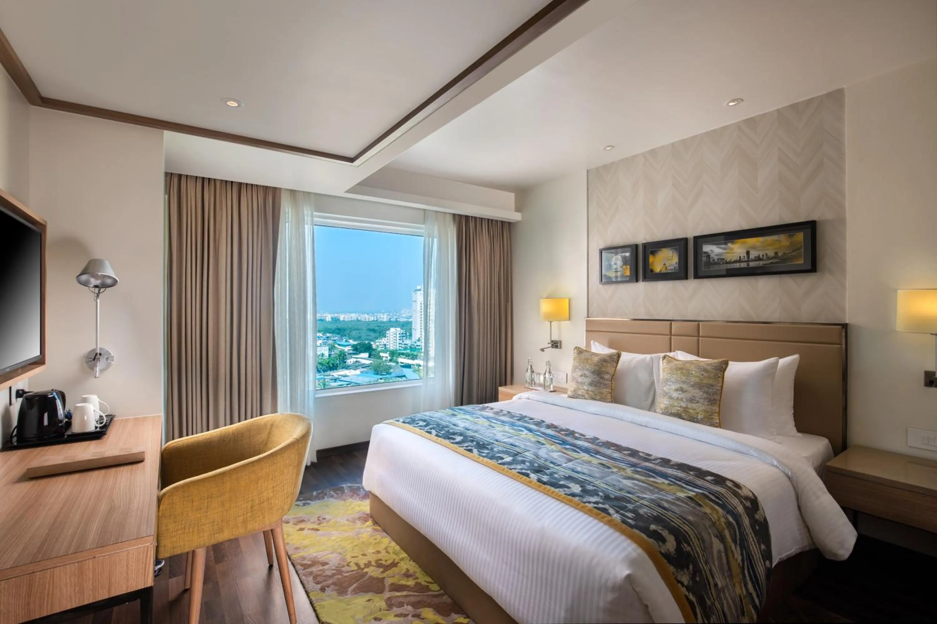 Bed in Royal Hometel Suites