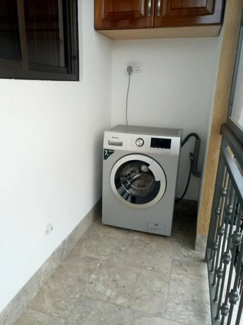 washing machine in Caran Apartments
