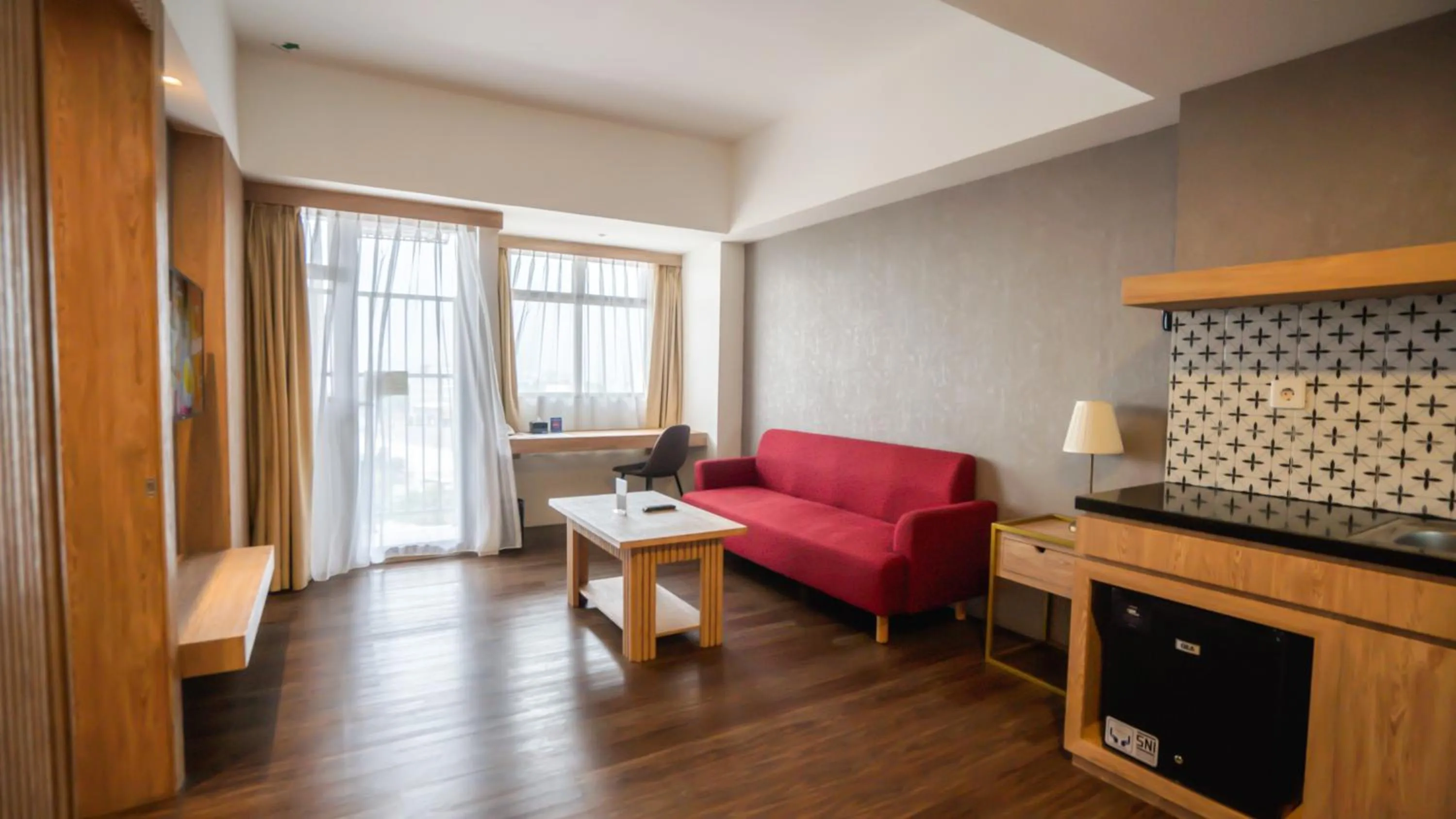 Living room in Bigland Bogor Hotel Powered by Archipelago