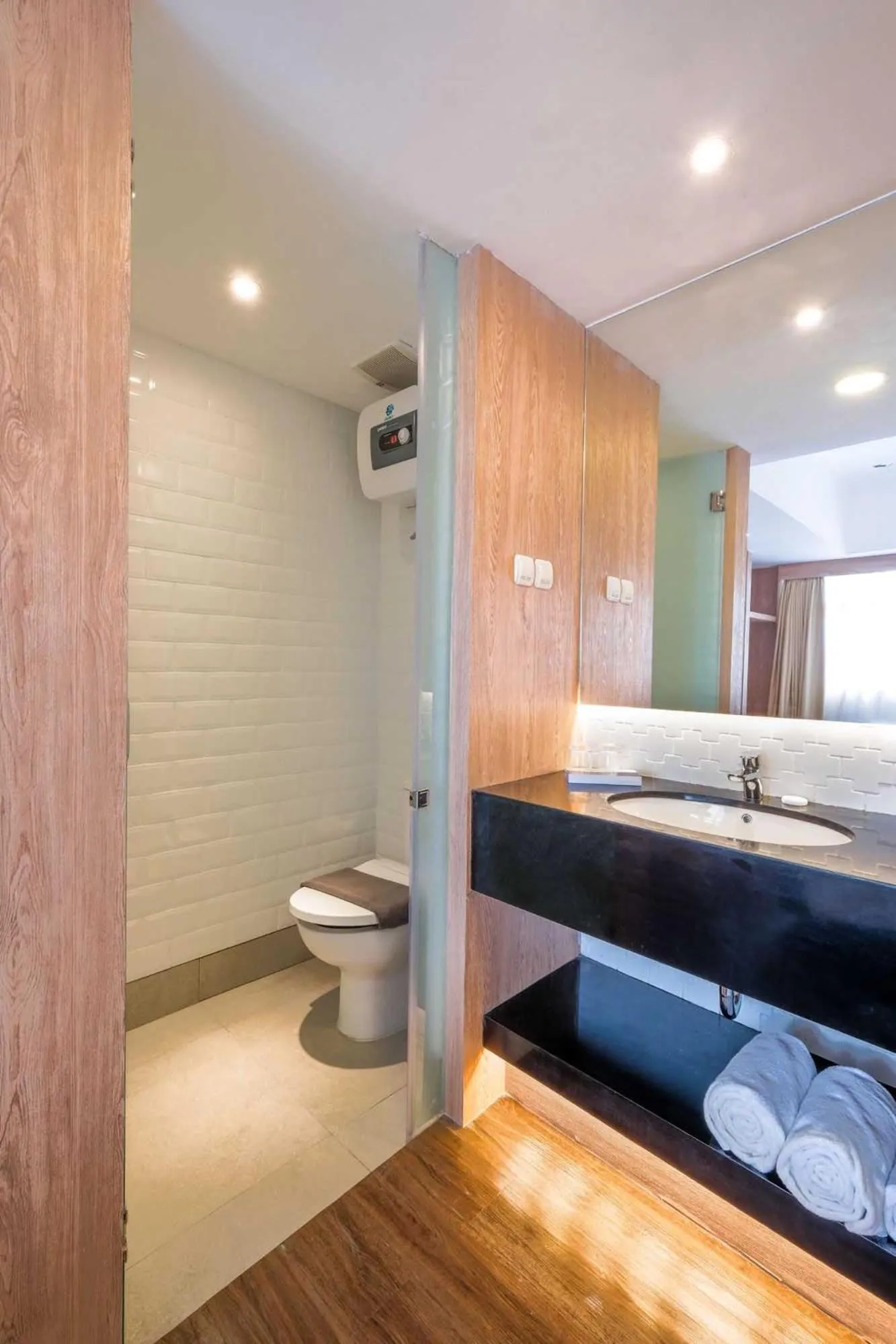 Toilet, Bed in Bigland Bogor Hotel Powered by Archipelago