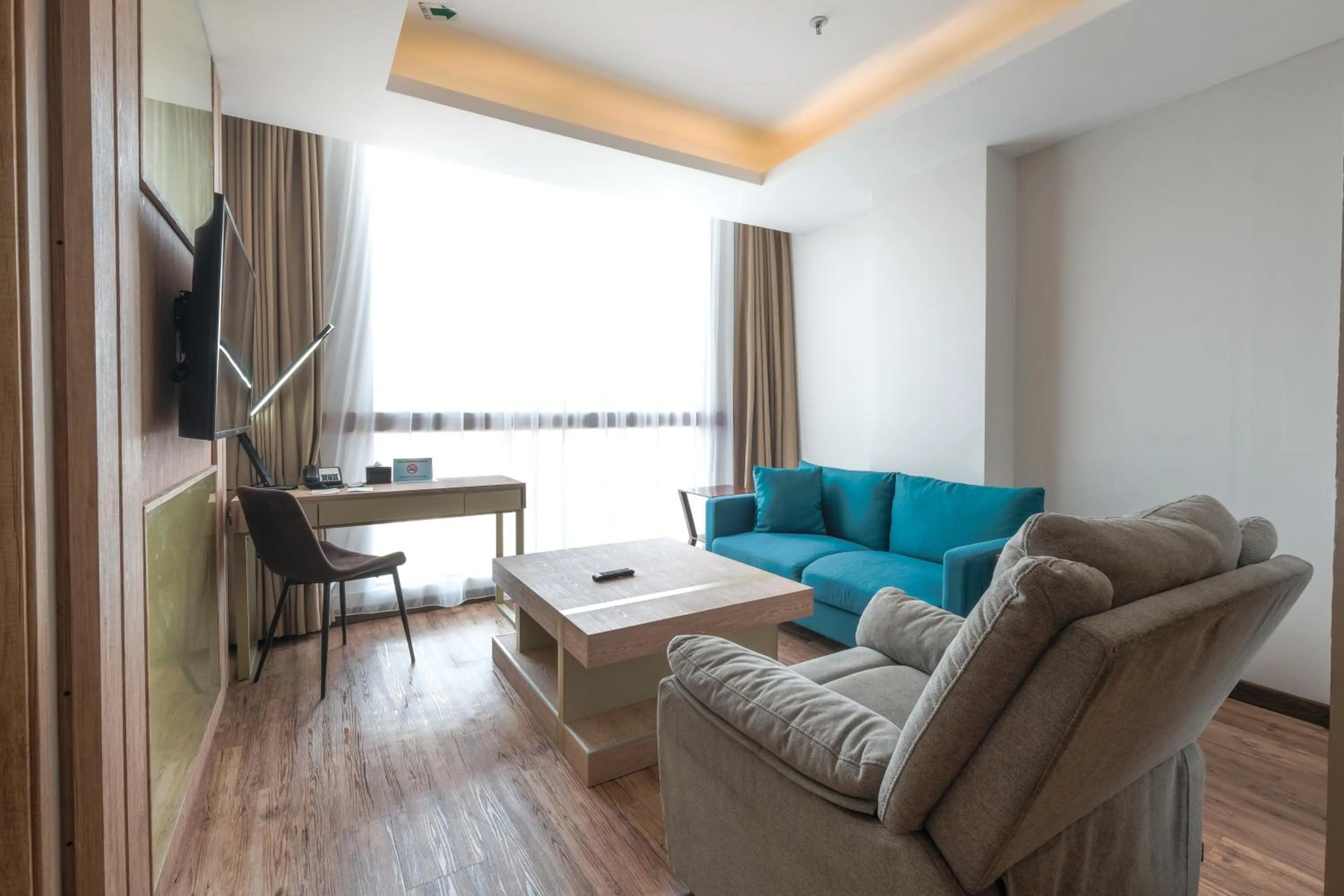 Living room in Bigland Bogor Hotel Powered by Archipelago