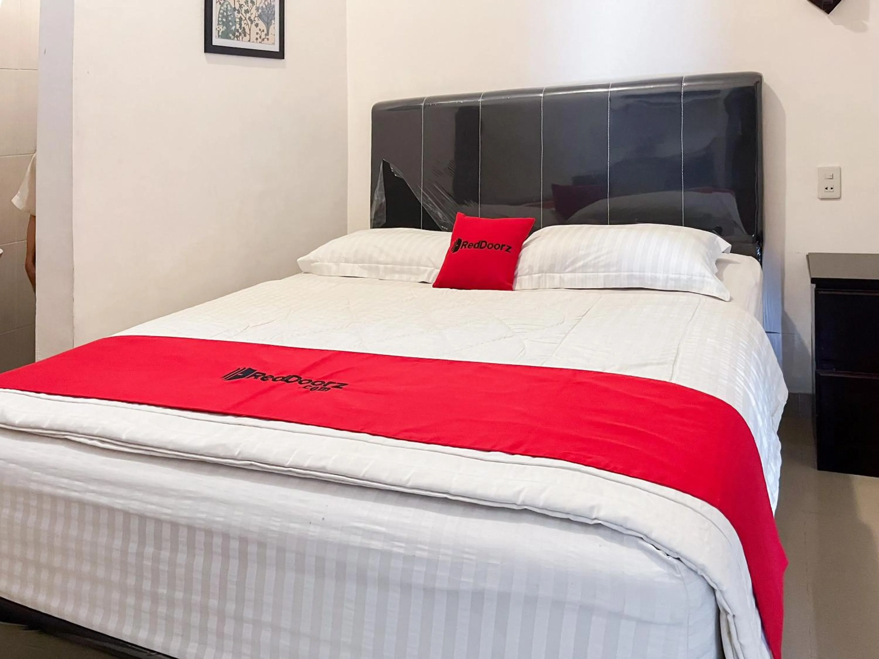 Bed in OYO 1500 Mh Homestay