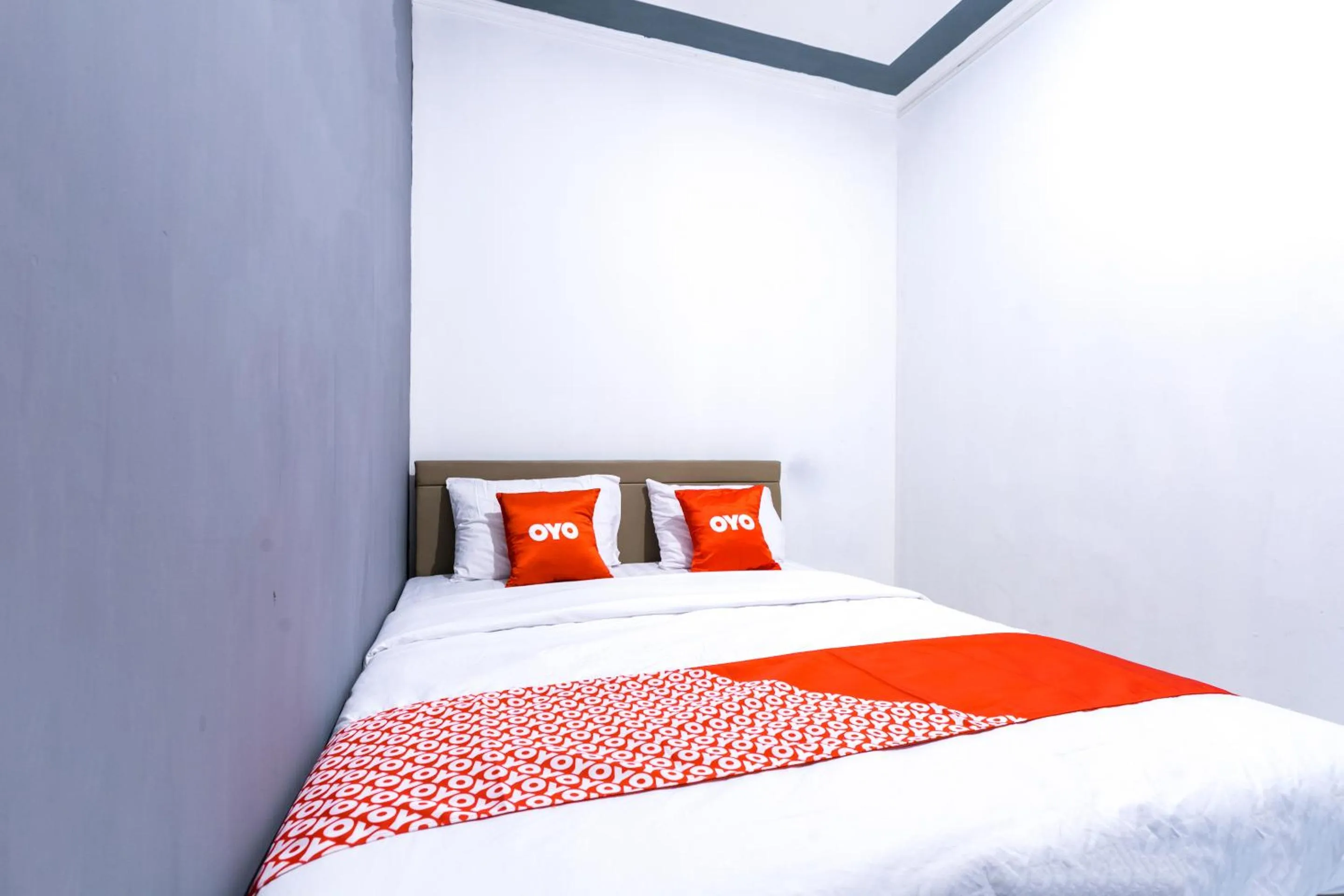 Bedroom in OYO 1421 Kasmaran Guest House Syariah