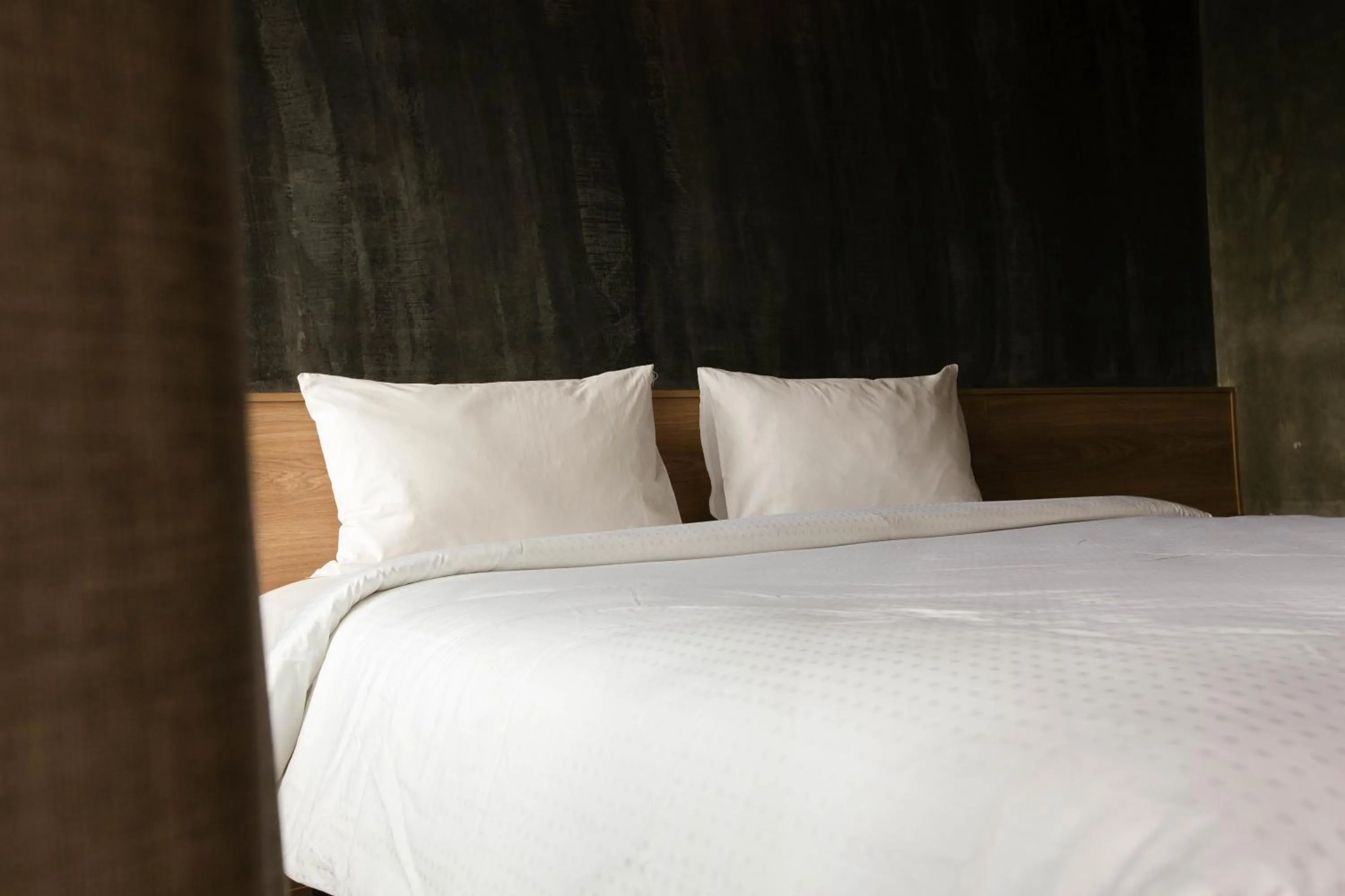 Bed in Navakitel Design Hotel