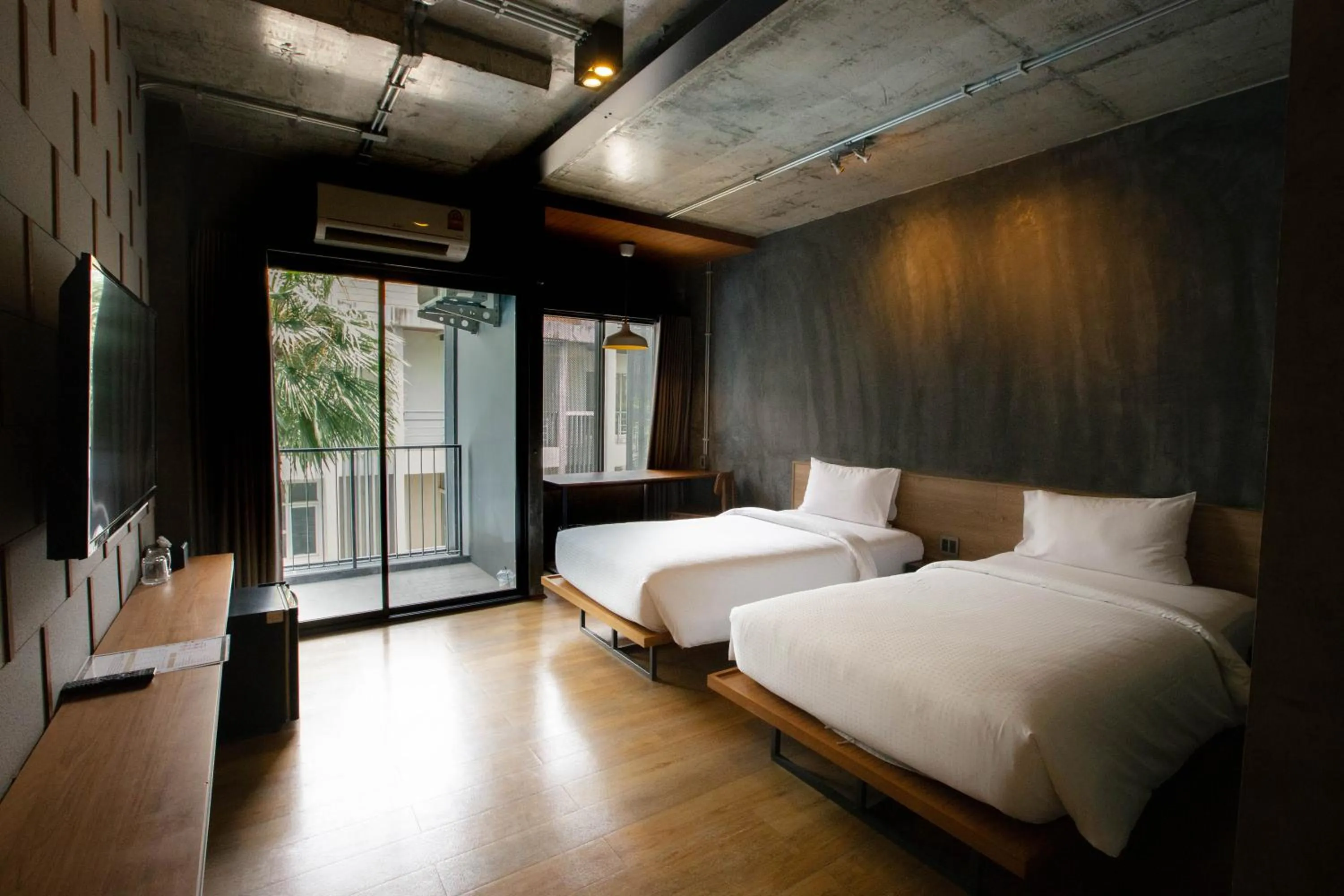 Communal lounge/ TV room, Bed in Navakitel Design Hotel