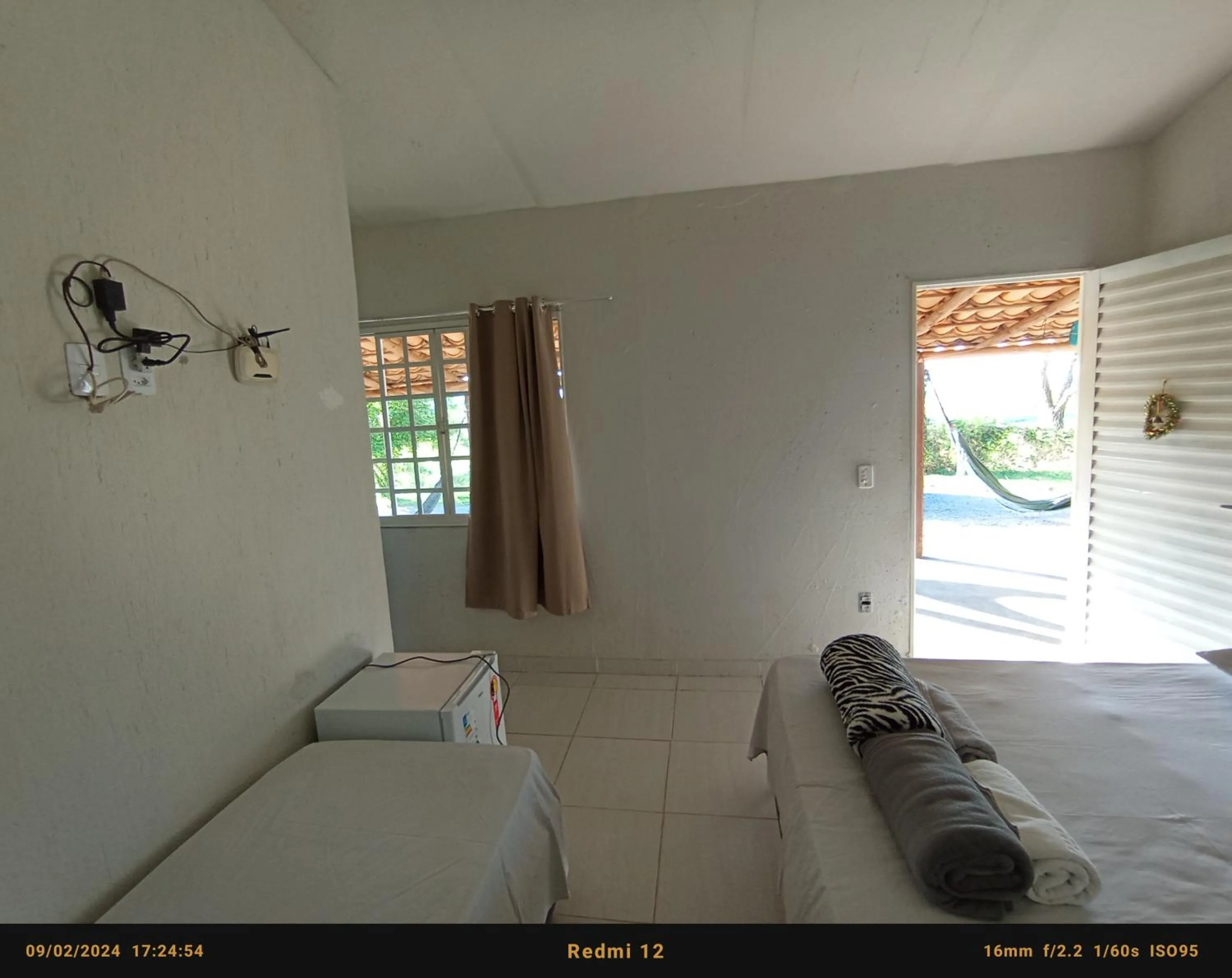 Bed in Pousada flores de ipê