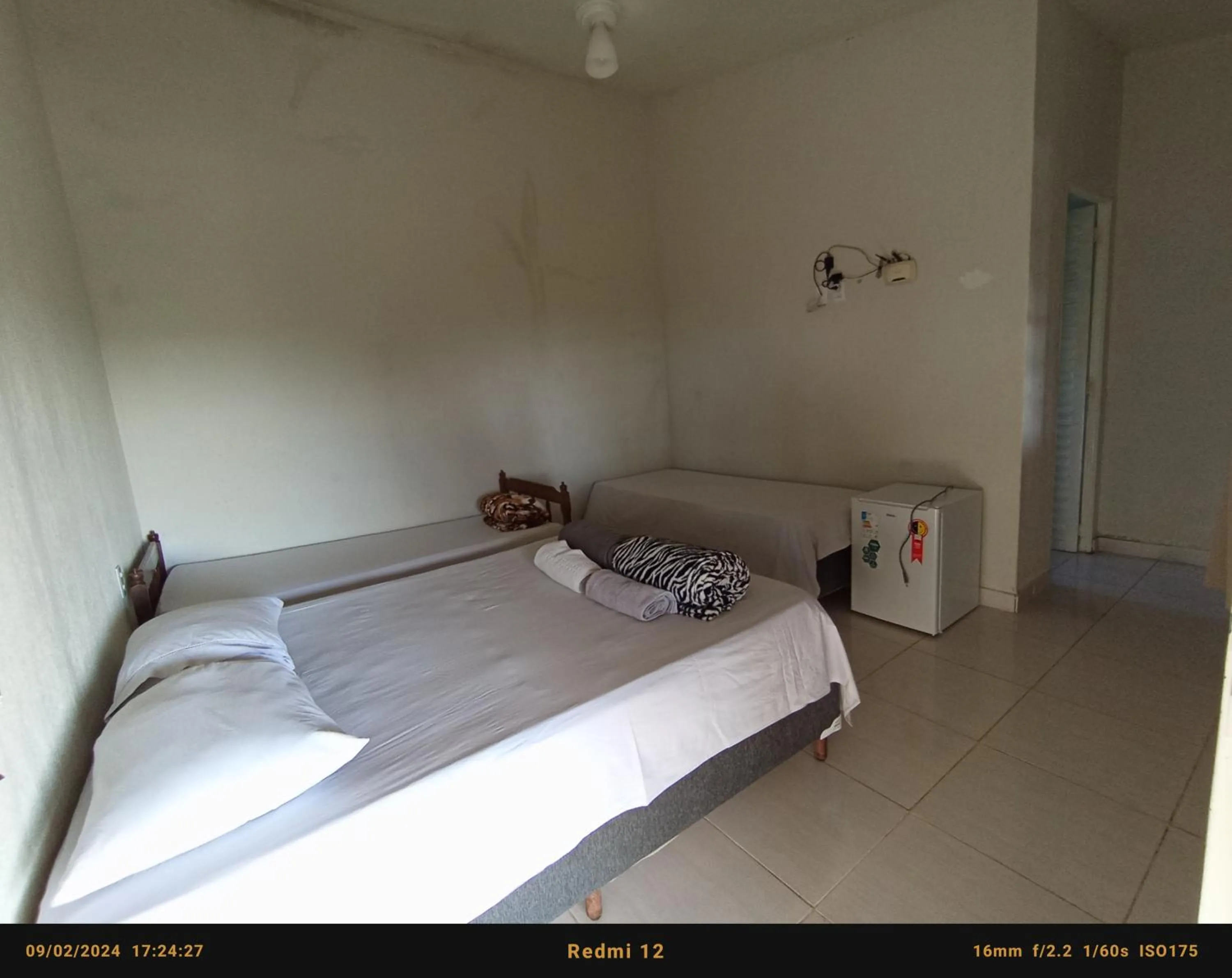 Bed in Pousada flores de ipê