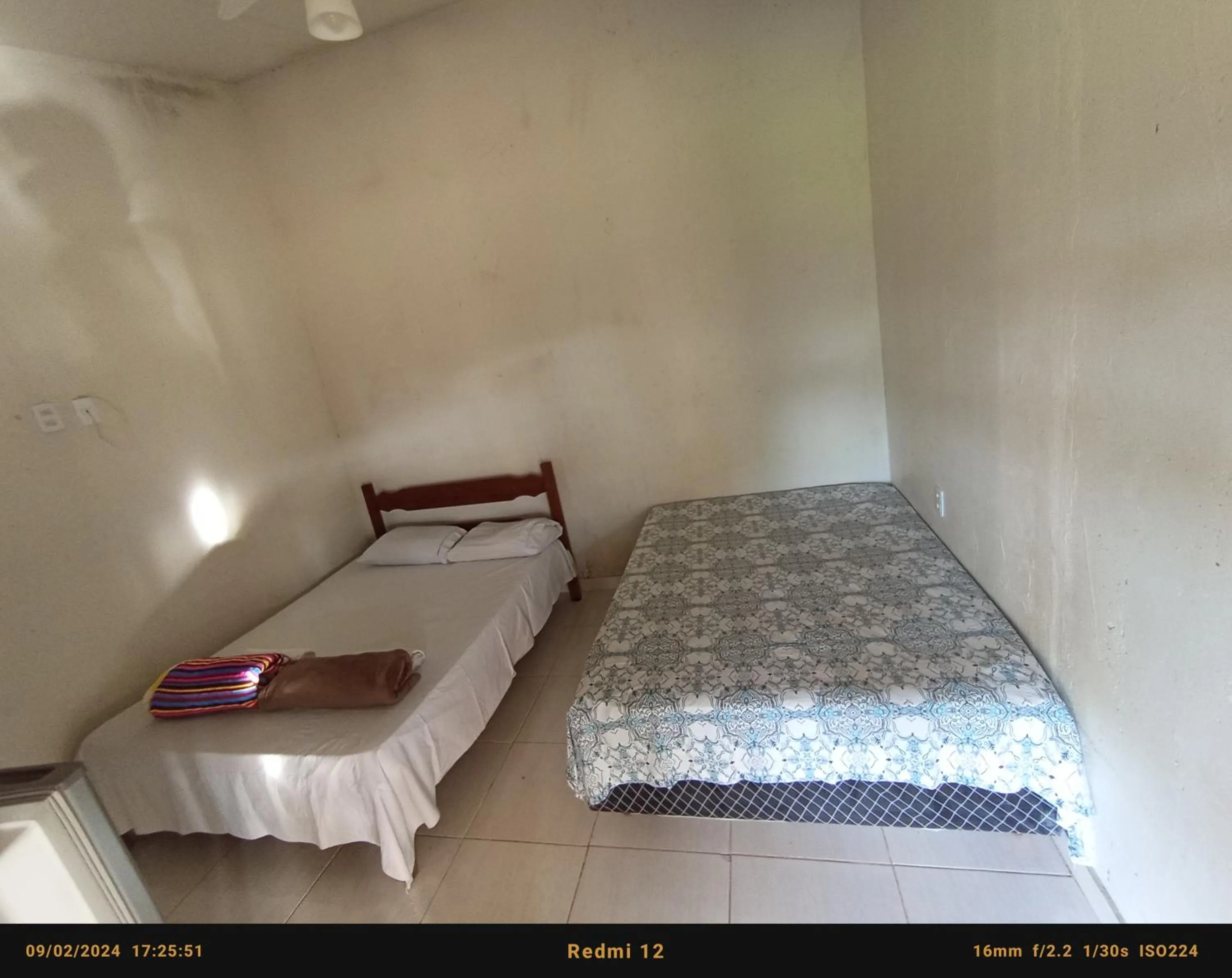 Bed in Pousada flores de ipê