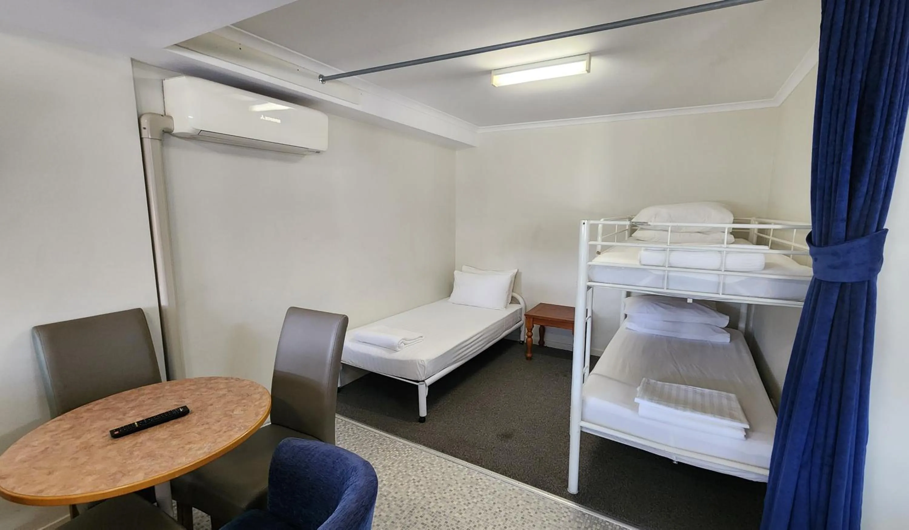 Bed in T's Resort & Motel