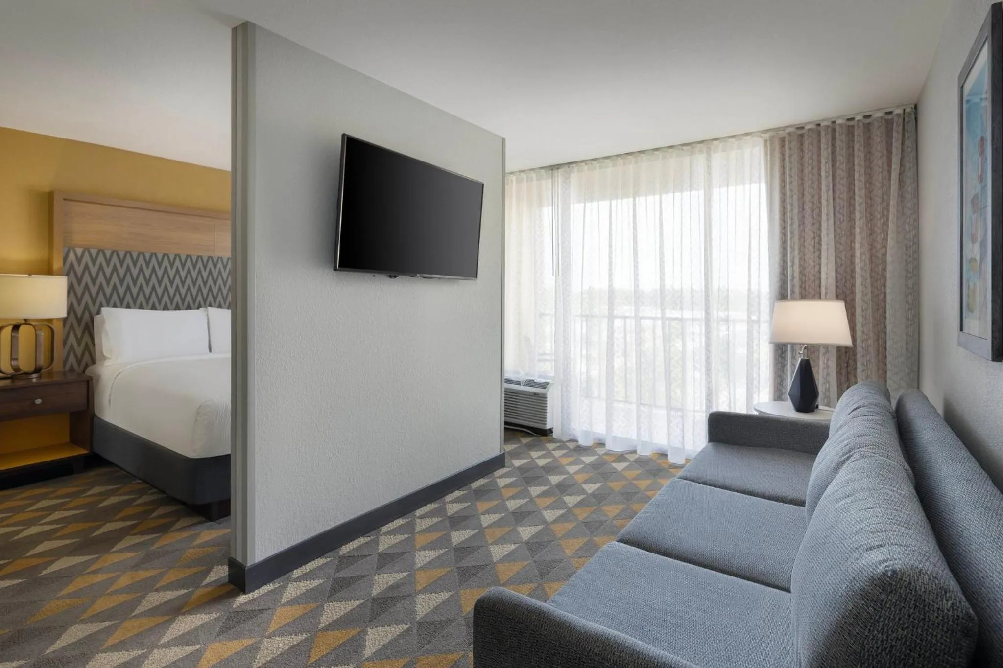 Photo of the whole room, Bed in Holiday Inn & Suites Orlando SW - Celebration Area by IHG