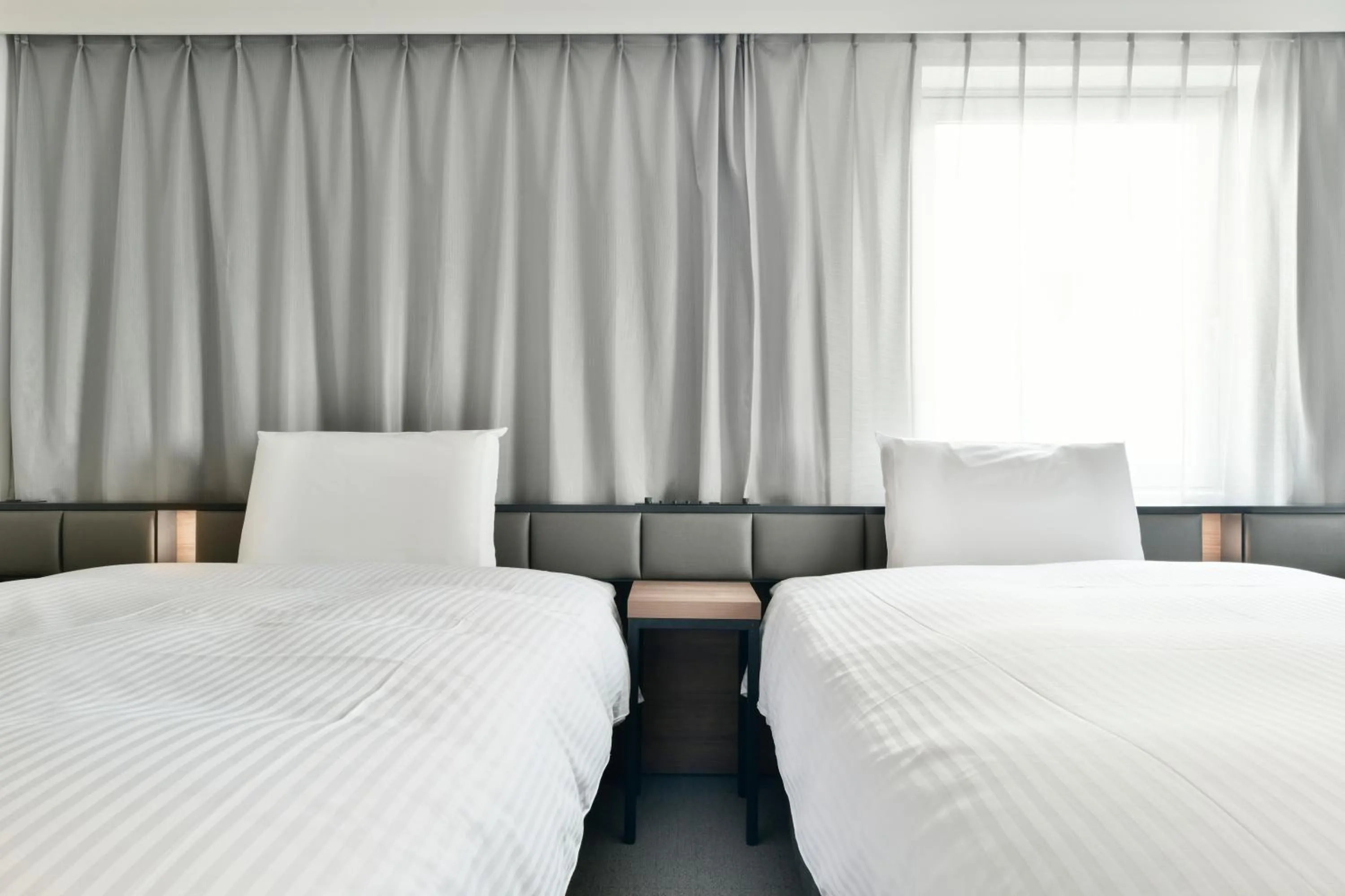 Bed in Vessel Inn Keisei Tsudanuma Station