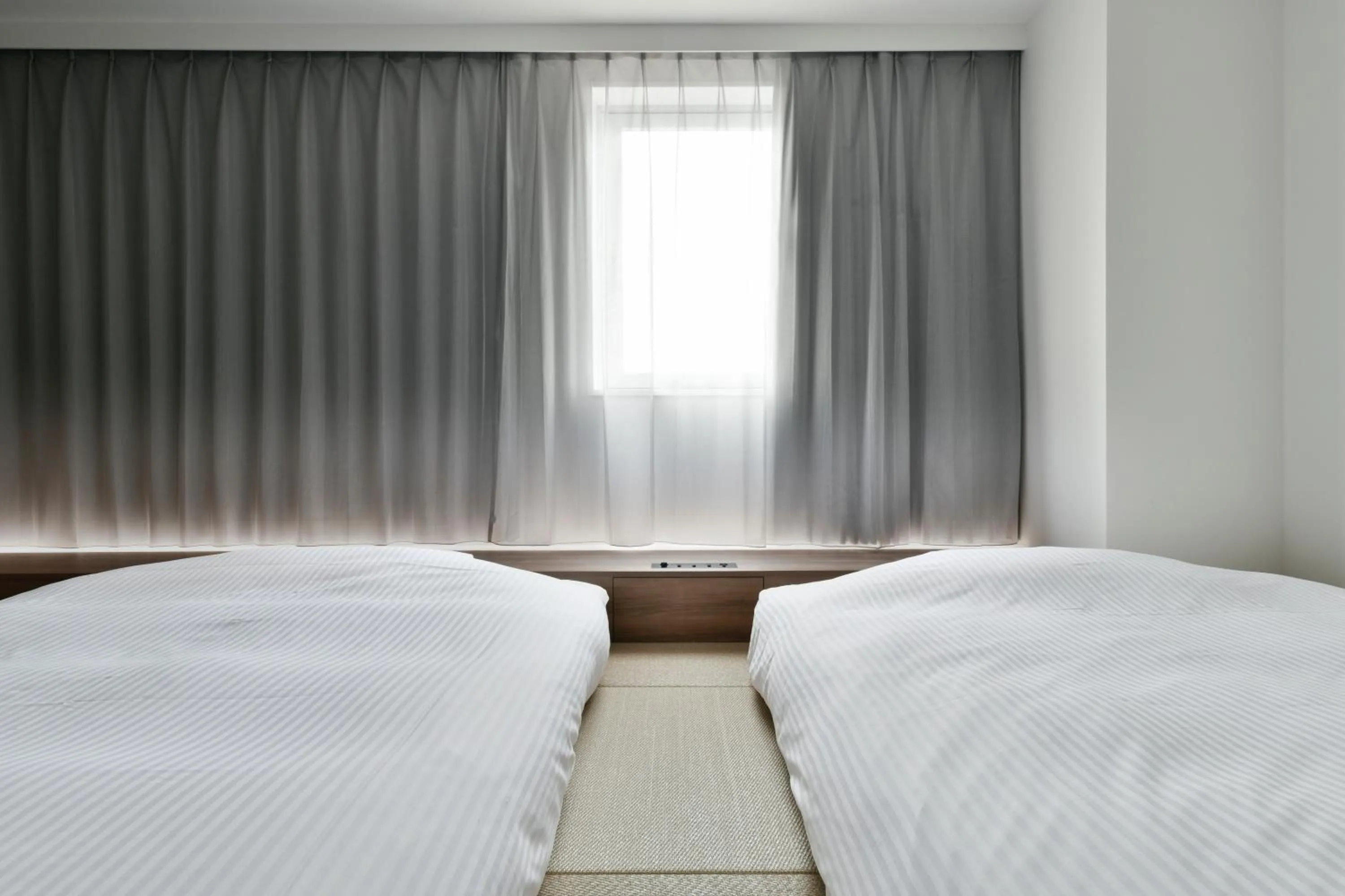 Bed in Vessel Inn Keisei Tsudanuma Station