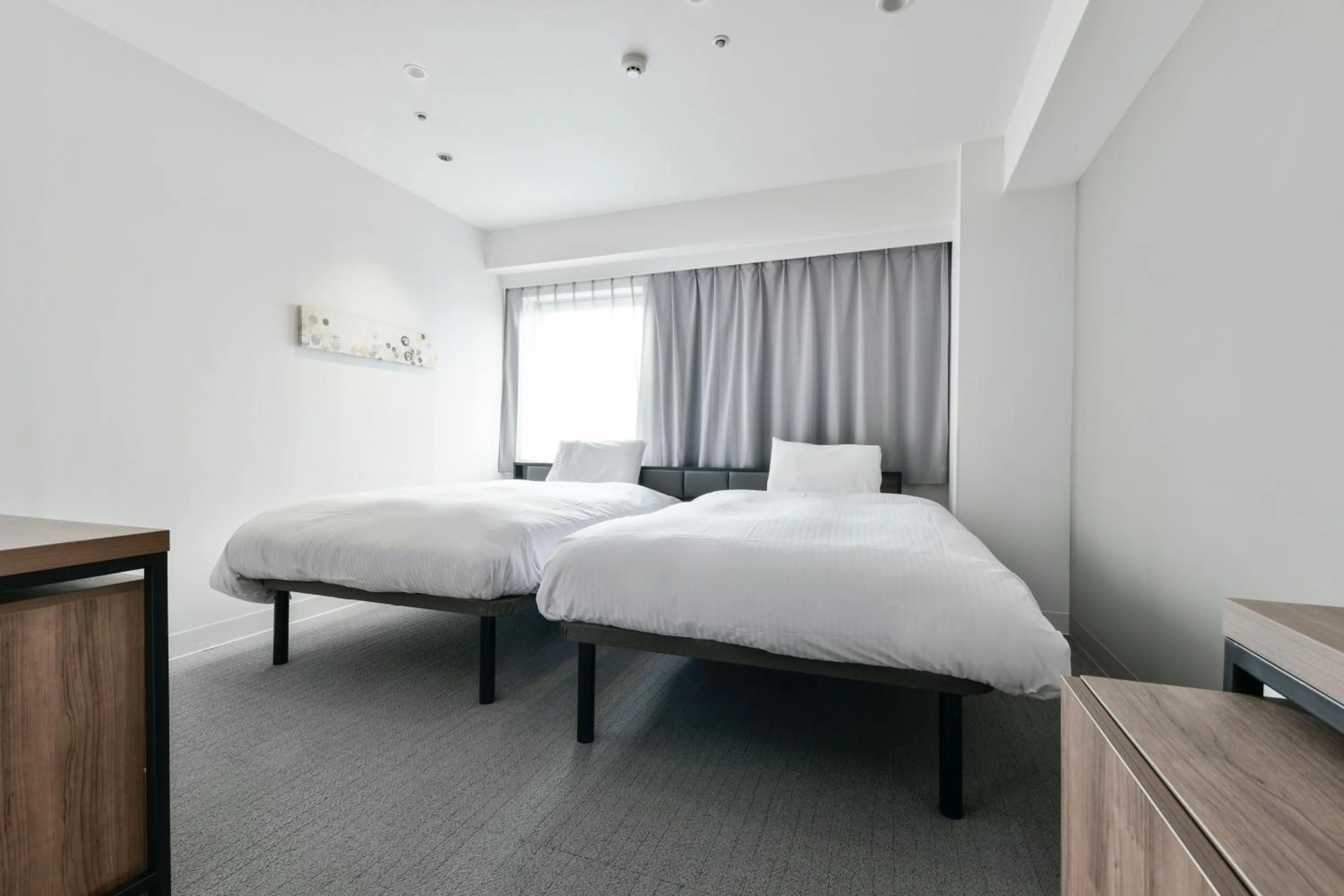 Bed in Vessel Inn Keisei Tsudanuma Station