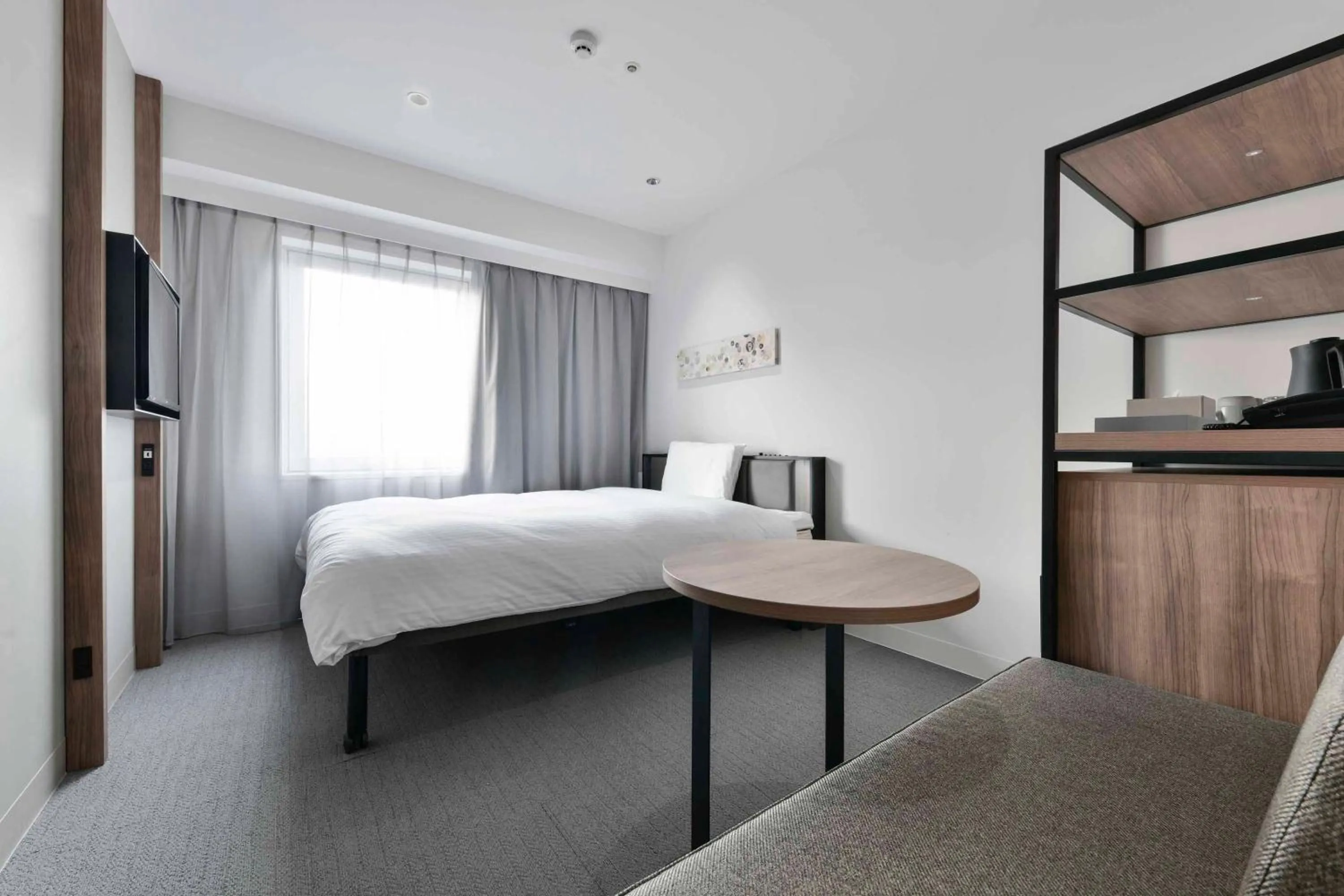 Bed in Vessel Inn Keisei Tsudanuma Station