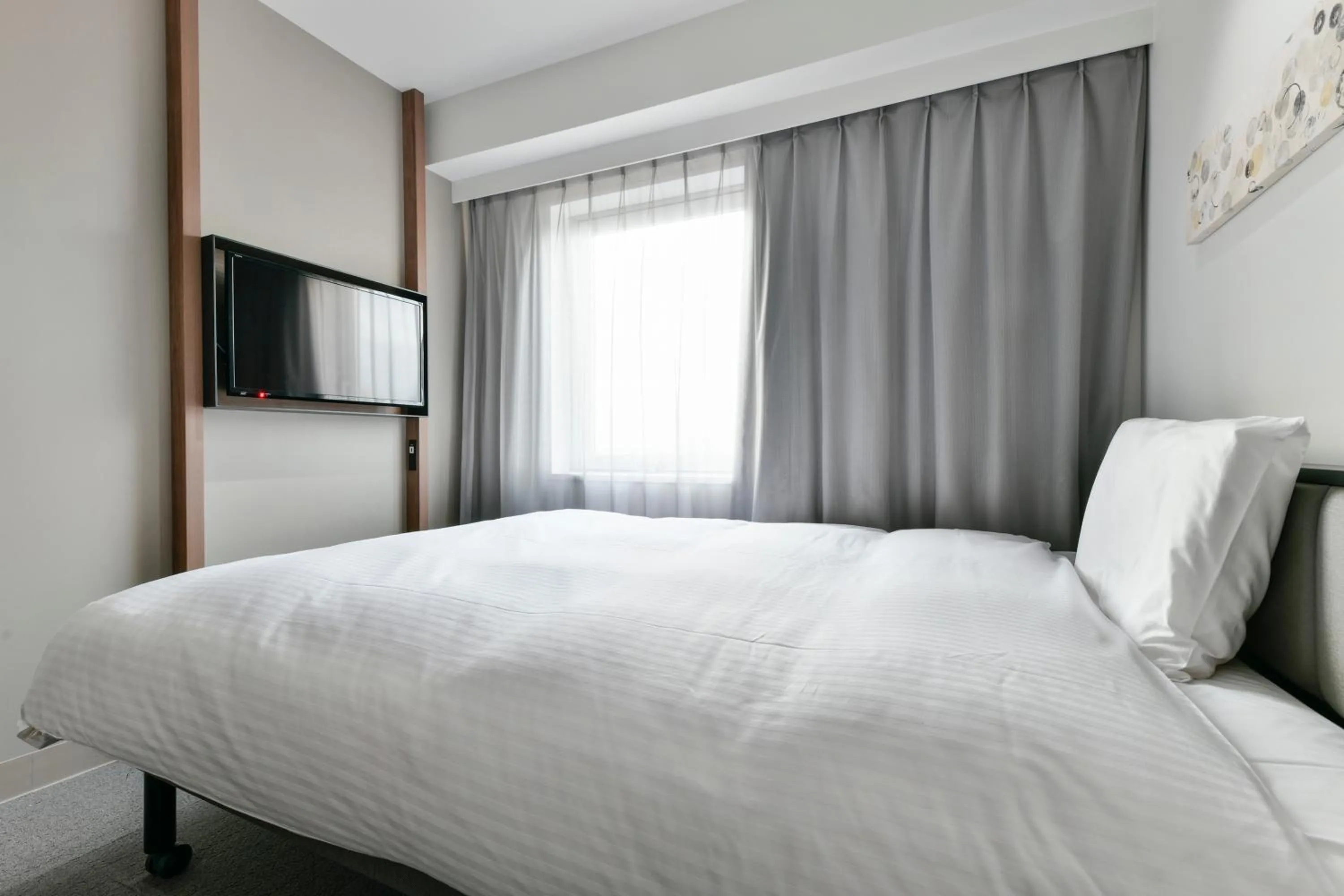 Bed in Vessel Inn Keisei Tsudanuma Station