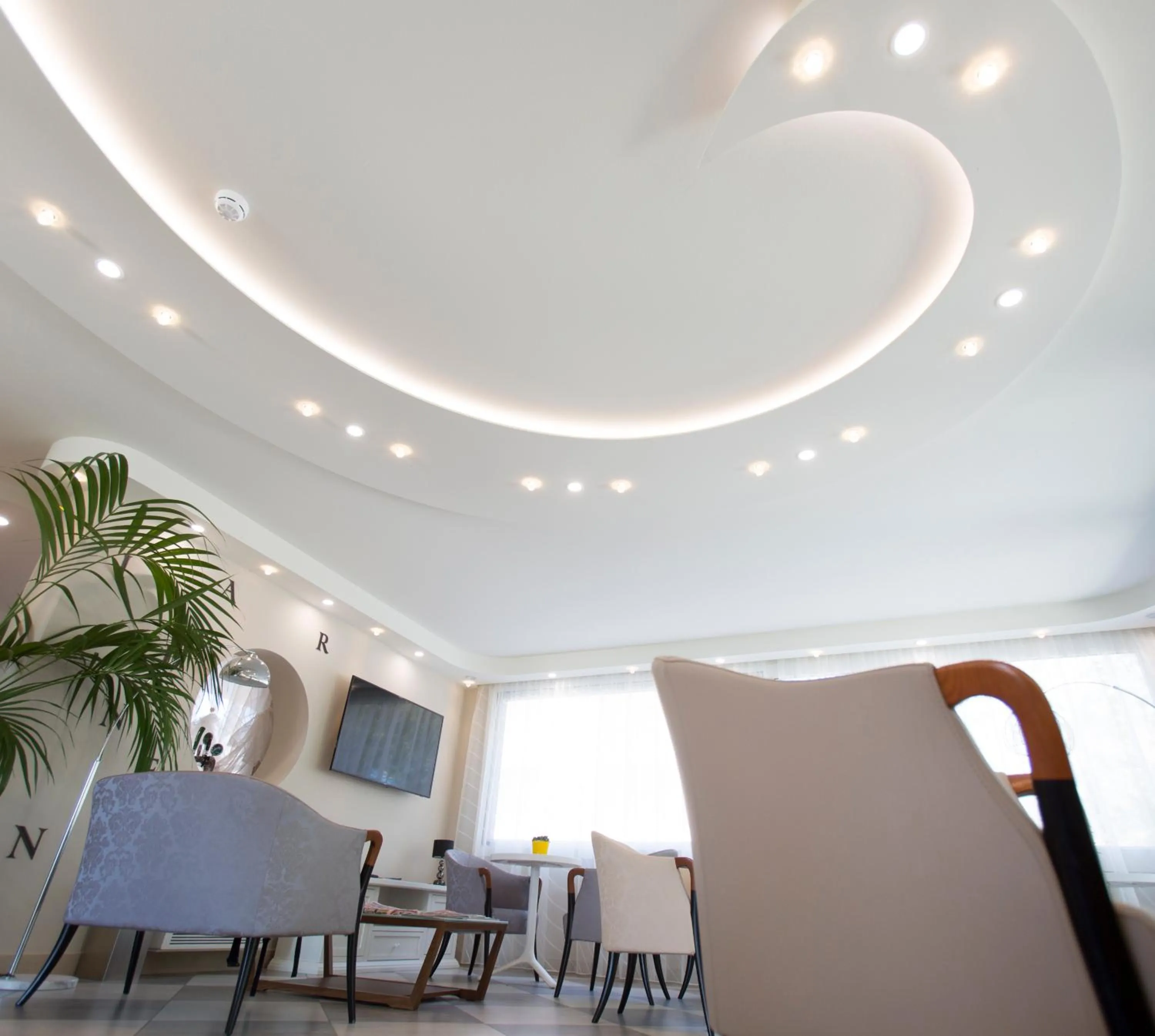 Communal lounge/ TV room in Nero D'Avorio Aparthotel & SPA