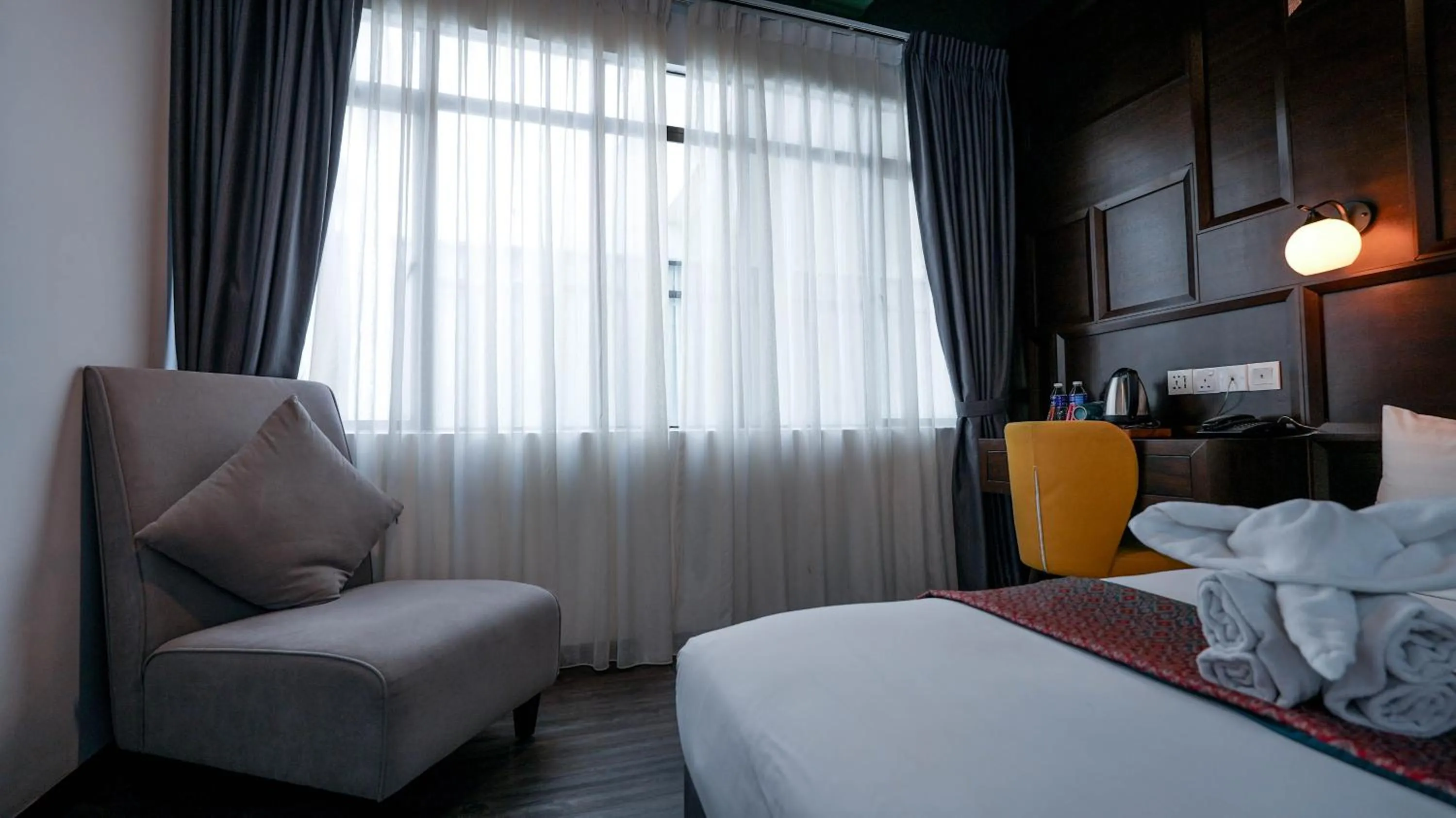 Seating area, Bed in East Riverine Boutique Hotel