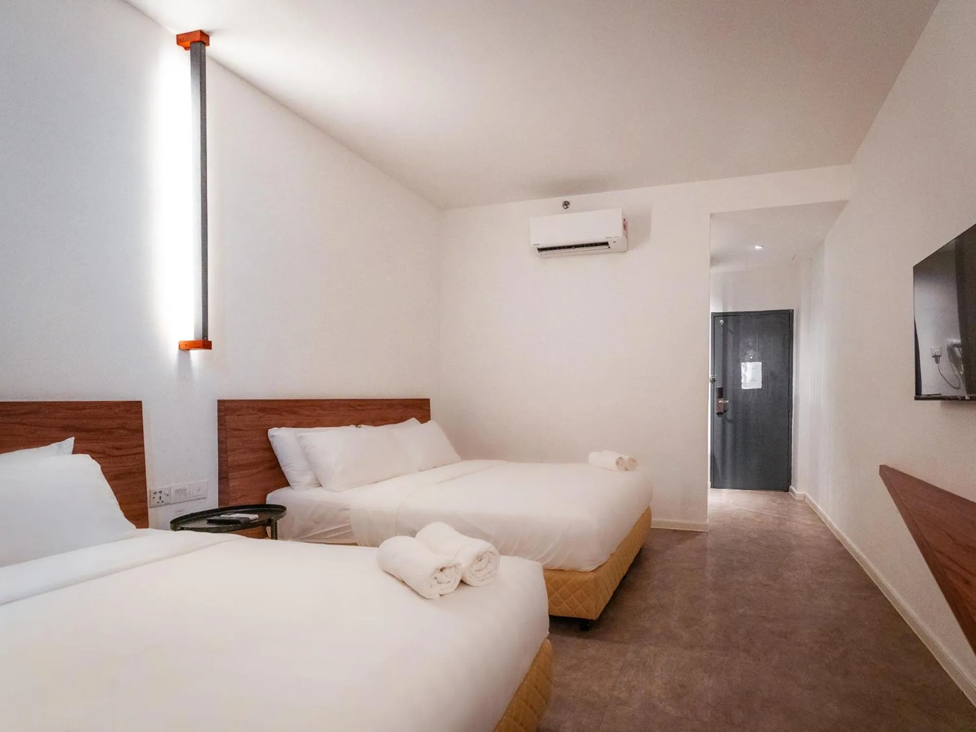 Bed in T+ PREMIUM HOTEL