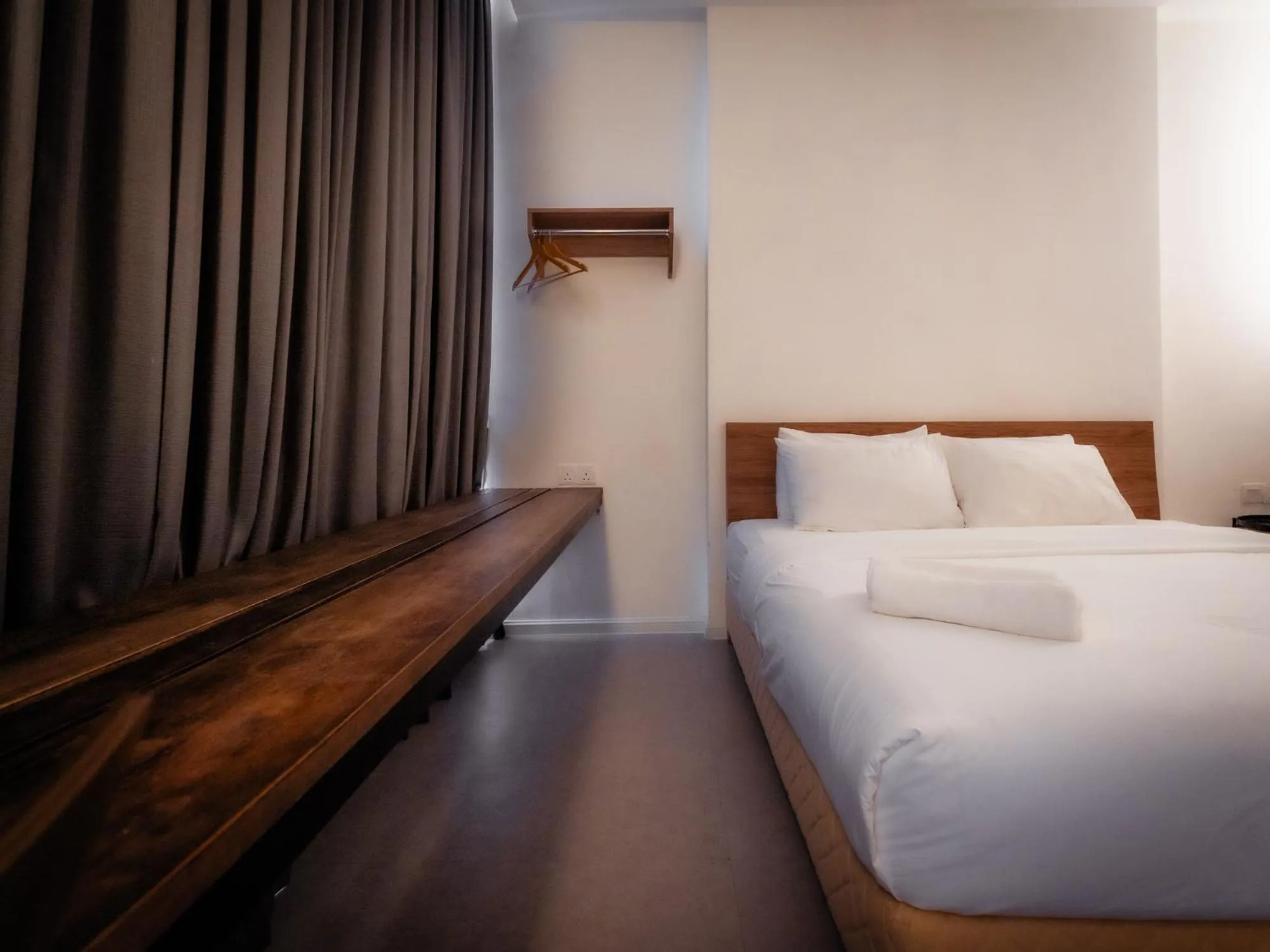 Bed in T+ PREMIUM HOTEL