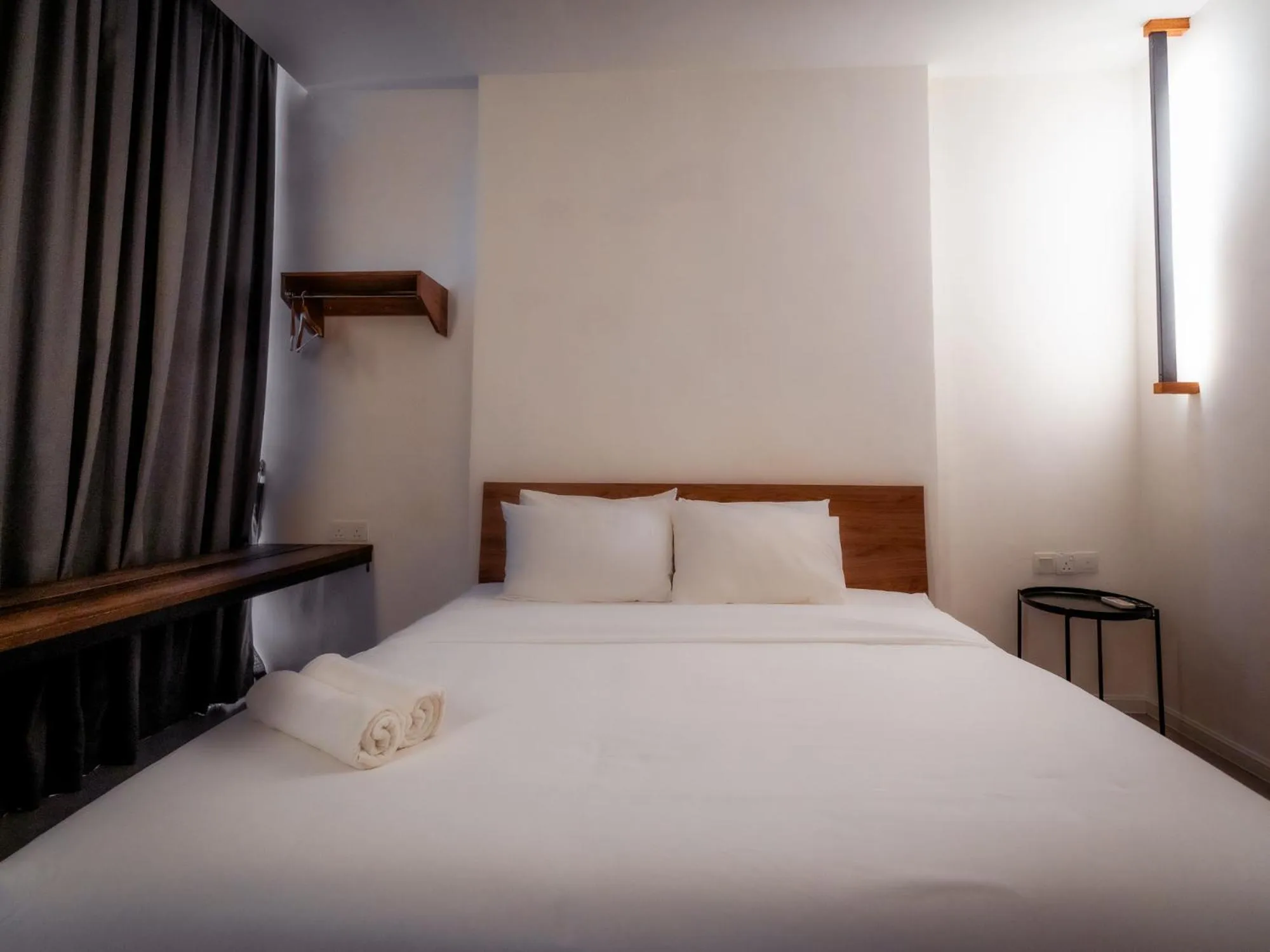 Bed in T+ PREMIUM HOTEL